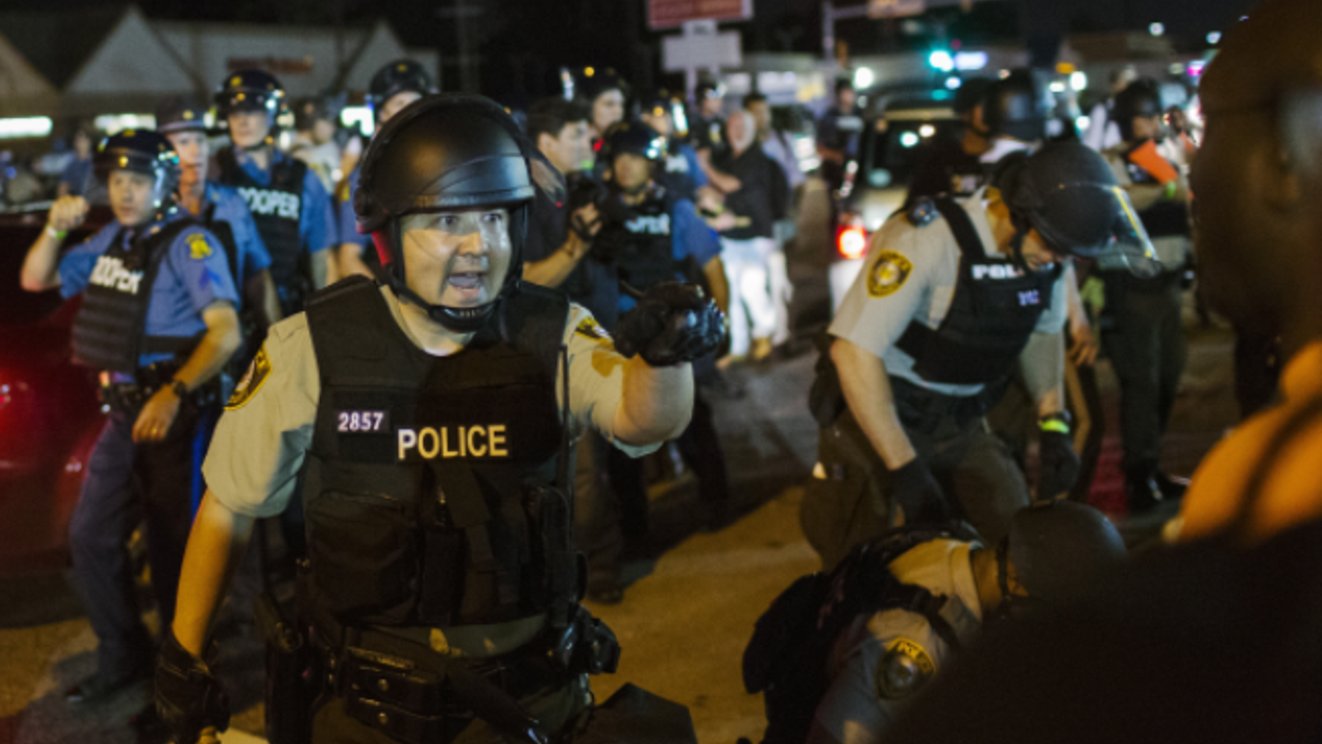 St. Louis police officers in riot gear clashed with protesters during the Ferguson, Missouri riots in August 2015.
