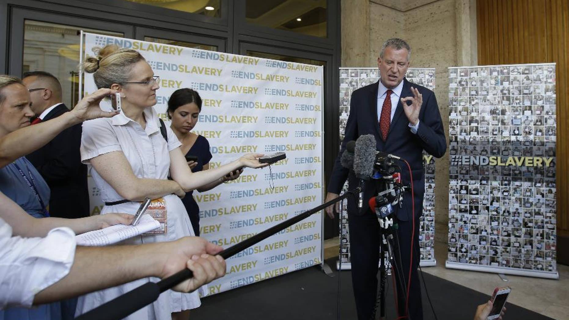 New York Mayor Bill de Blasio holds a press conference outside the Synod Hall after participating in a conference on Modern Slavery and Climate Change at the Vatican, Tuesday, July 21, 2015. Dozens of environmentally friendly mayors from around the world are meeting at the Vatican this week to bask in the star power of eco-Pope Francis and commit to reducing global warming and helping the urban poor deal with its effects. (AP Photo/Gregorio Borgia)