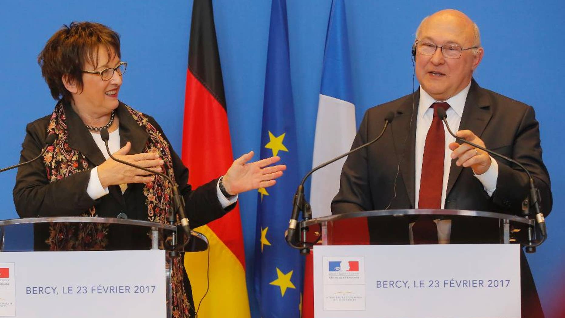 Germany's Economic Affaire and Energy Minister Brigitte Zypries, left, and France's Finance Minister Michel Sapin attend a media conference at the ministry in Paris, Thursday, Feb. 23, 2017. France's Finance Minister Michel Sapin and his Germany's Economy Affair and Energy Minister Brigitte Zypries discussed during their meeting the future of General Motors' Opel subsidiary. (AP Photo/Michel Euler)