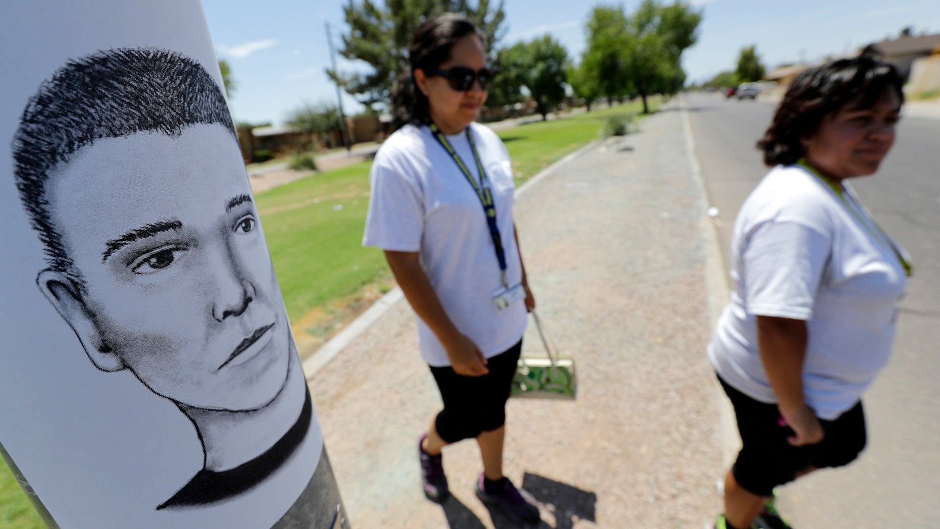Phoenix neighborhood patrol officers walk Maryvale neighborhood streets in Phoenix, Ariz.