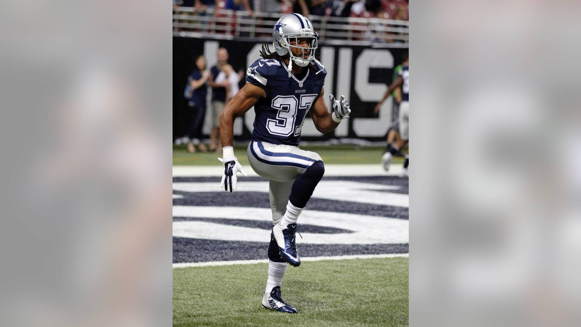 In this Sept. 21, 2014, photo, Dallas Cowboys' C.J. Spillman warms up for the Cowboys' NFL football game against the St. Louis Rams in St. Louis. Spillman is under investigation but hasn't been arrested or charged after a report of an alleged sexual assault at the team hotel last month. Grapevine, Texas, police spokesman Sgt. Robert Eberling said Wednesday night, Oct. 1, that the alleged incident took place early the morning of Sept. 20 at the Gaylord Texan Resort and Convention Center. Spillman's agent and attorney declined to comment. (AP Photo/Tom Gannam)