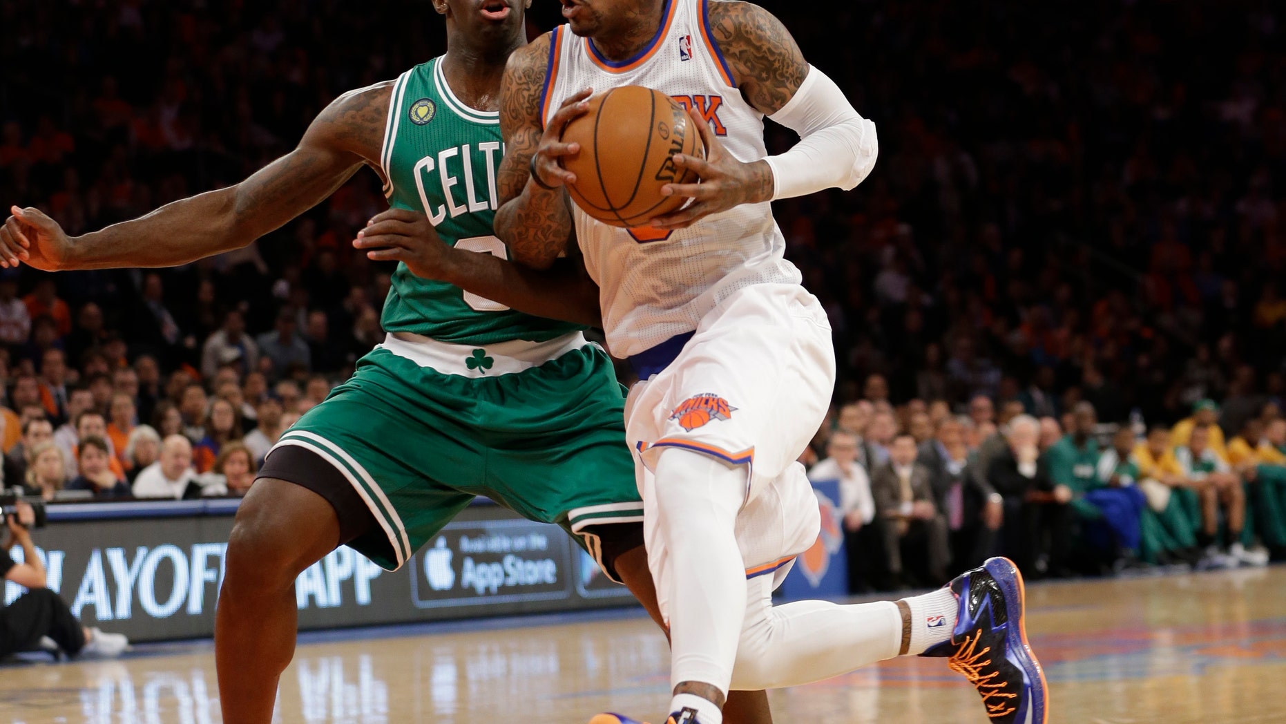 New York Knicks guard J.R. Smith, right, drives past Boston Celtics forward Jeff Green (8) during the first half of Game 1 in the first round of the NBA basketball playoffs at Madison Square Garden in New York, Saturday, April 20, 2013. (AP Photo/Kathy Willens)