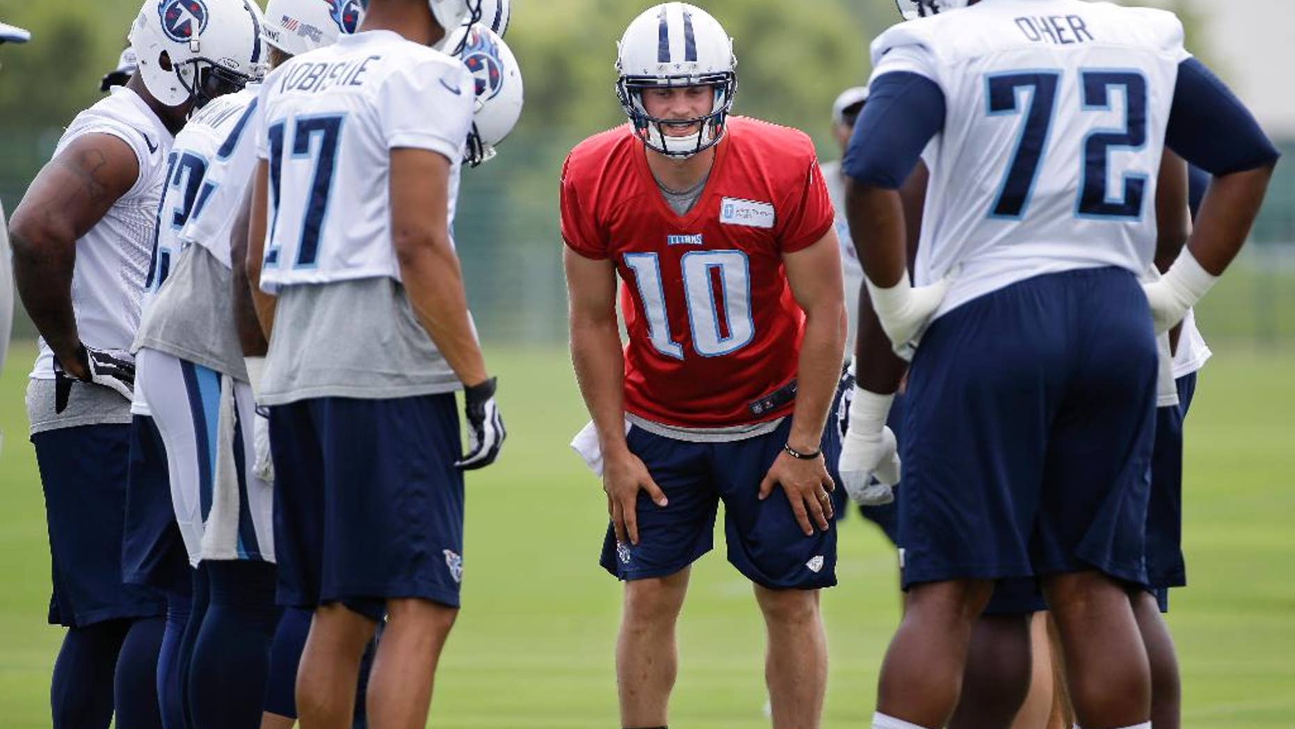 FILE -- This July 27, 2014 file photo shows Tennessee Titans quarterback Jake Locker (10) calling a play during NFL football training camp in Nashville, Tenn. Locker says he's financially set for life thanks to his rookie NFL contract. His motivation to win games remains strong as ever, and the Tennessee quarterback goes into the final year of that deal needing to prove he can stay on the field long enough to lead the Titans. (AP Photo/Mark Humphrey, File)