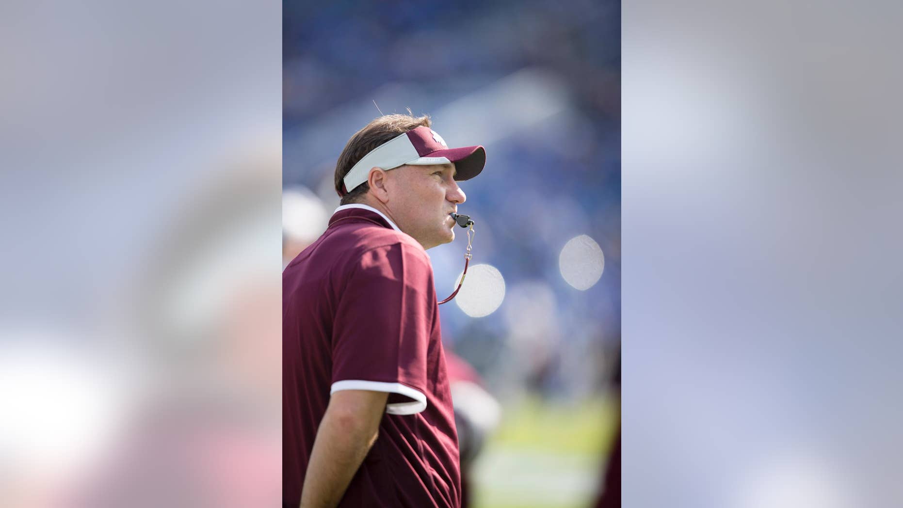Mississippi State head coach Dan Mullen watches his team warm up before an NCAA college football game against Kentucky at Commonwealth Stadium in Lexington, Ky., Saturday, Oct. 25, 2014. (AP Photo/David Stephenson)