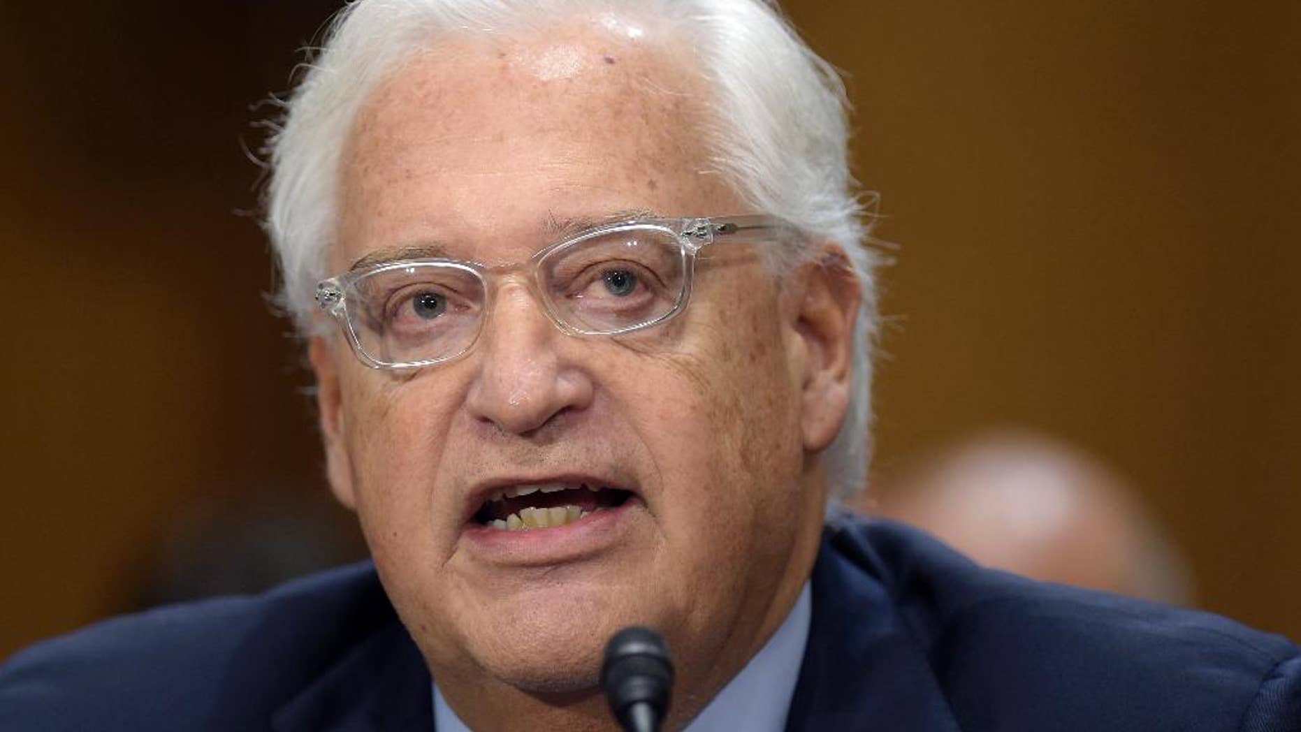 FILE - In this Feb. 16, 2017 file photo, U.S. Ambassador Israel-designate David Friedman testifies on Capitol Hill in Washington at his confirmation hearing before the Senate Foreign Relations Committee. The committee narrowly approved Friedman's nomination, Thursday, March 9, 2017. (AP Photo/Susan Walsh, File)