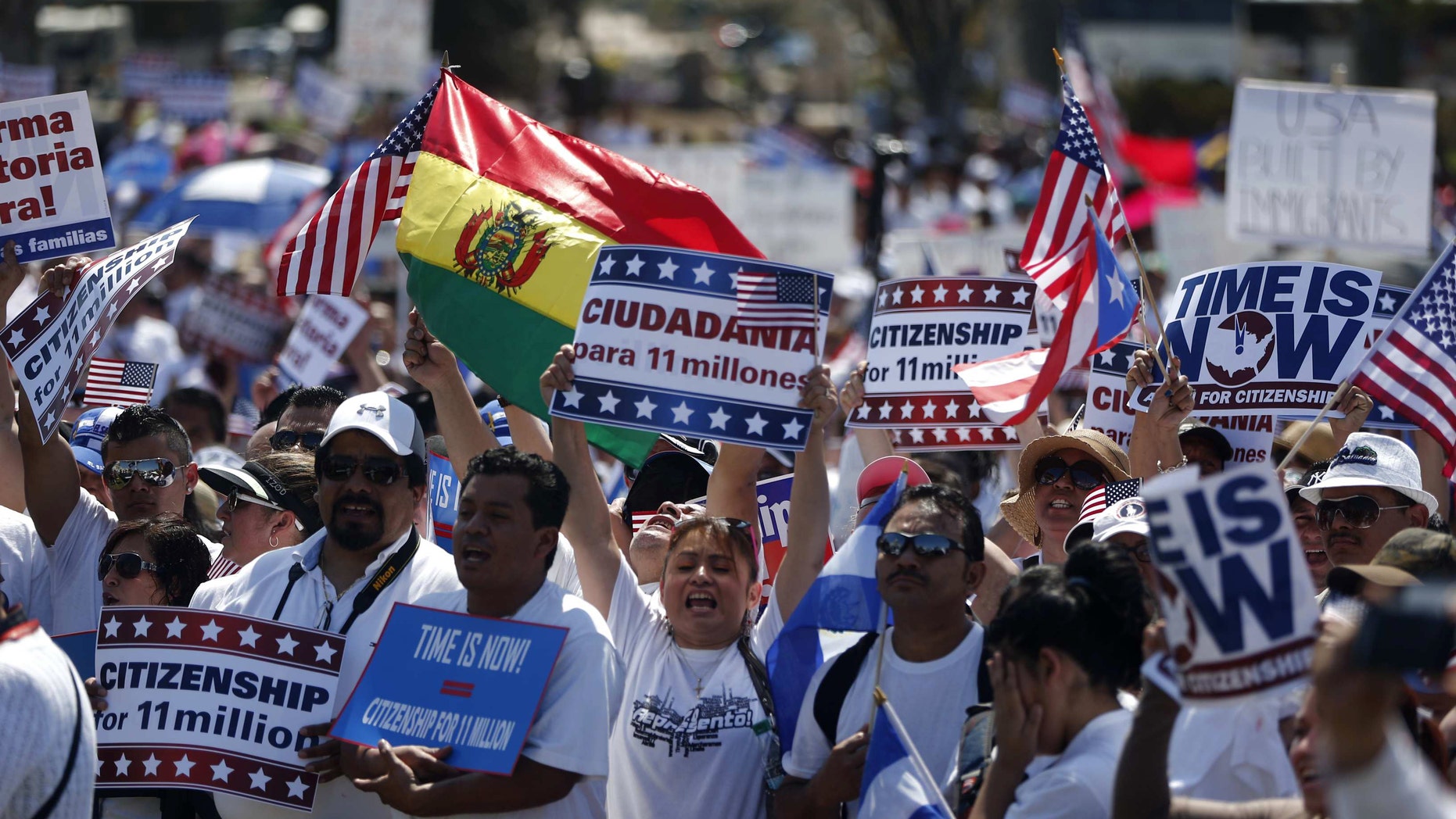 Activists participate in a rally for immigration reform on Capitol Hill in Washington, Wednesday, April 10, 2013, where tens of thousands of immigrants and their supporters are expected to rally for immigration reform. Bipartisan groups in the House and Senate are said to be completing immigration bills that include a pathway to citizenship for the nation's 11 million immigrants with illegal status. (AP Photo/Charles Dharapak)