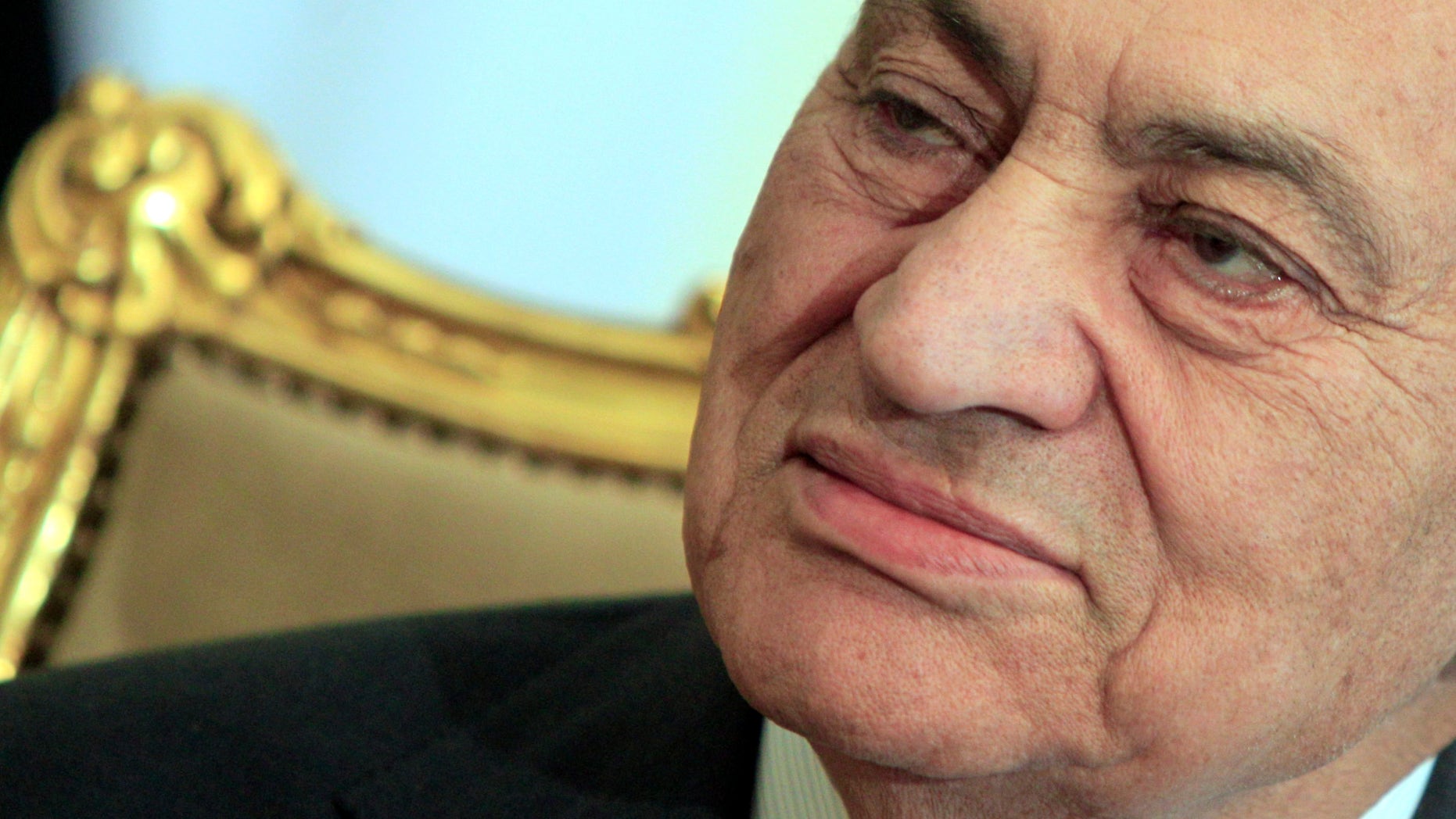 FILE - In this Tuesday, Feb. 8, 2011 file photo, the Egyptian President Hosni Mubarak sits during his meeting with Emirates foreign minister, not pictured, at the Presidential palace in Cairo, Egypt. Egypt’s state news agency says the country’s top prosecutor has ordered ousted President Hosni Mubarak be detained for 15 days pending investigation into a new case of corruption by him and his family for pocketing state funds slated for the presidential palaces. Mubarak, 84, in detention since April 2011, is currently held in a military hospital because of health issues. (AP Photo/Amr Nabil, File)