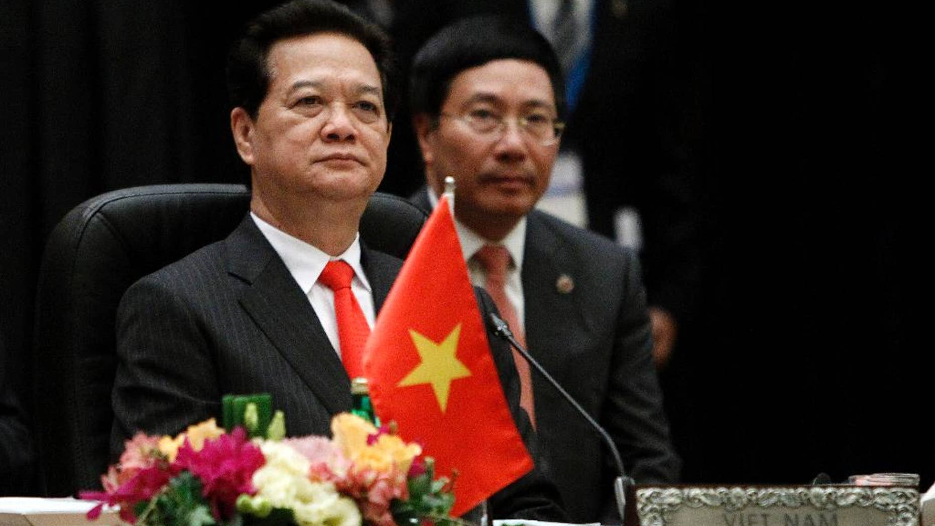 FILE - in this April 27, 2015 file photo, Vietnam's Prime Minister Nguyen Tan Dung waits for the plenary session of the 26th ASEAN Summit in Kuala Lumpur, Malaysia. Dung stepped down Wednesday, April 6, 2016, after 10 years in office, leaving behind a mixed legacy of promoting failed state enterprises but at the same time attracting foreign investment and daring to challenge China. (AP Photo/Joshua Paul, File)