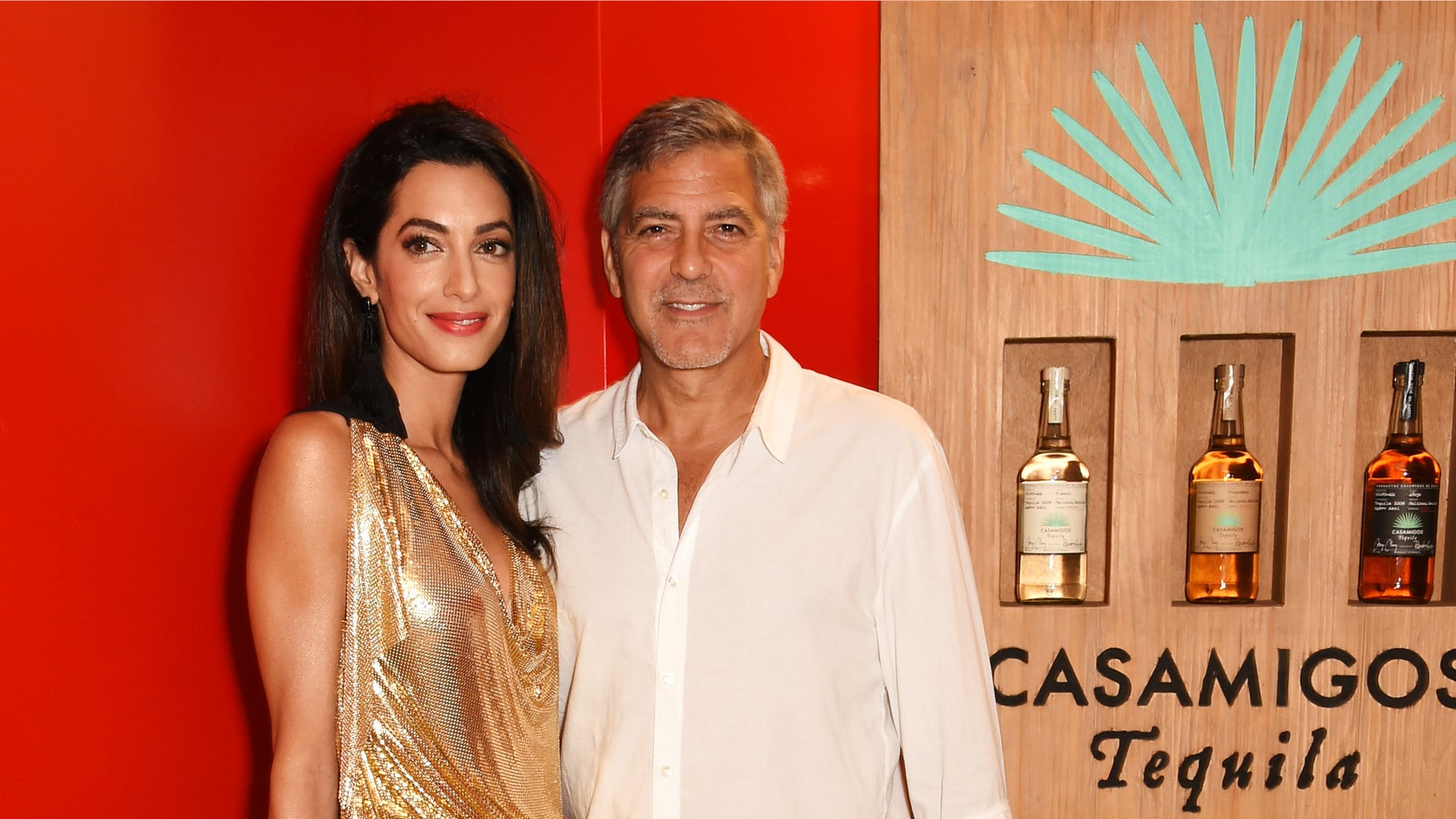 Amal and George Clooney at the official launch of Casamigos Tequila on August 23, 2015 in Ibiza, Spain.
