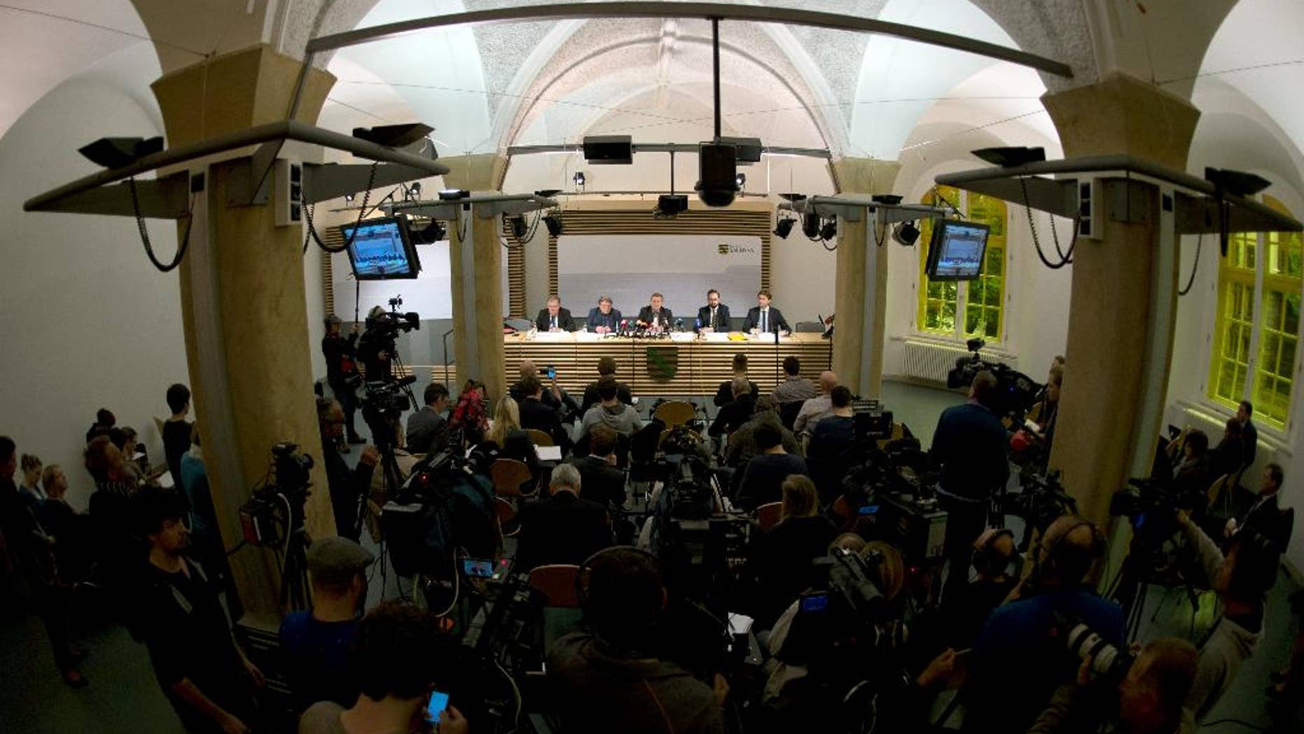 Saxony attourney general Klaus Fleischmann, Willi Schmid, corrections department head of the Saxon justice ministry; Rolf Jacob, director of the Justizvollzugsanstalt (JVA) Leipzig prison, ,and Saxony justice minister Sebastian Gemkow, from left, speak during a press conference on the death in Leipzig JVA of Jaber al-Bakr, who was arrested on suspicion of terrorism, during a press conference in Dresden, Germany, Thursday, Oct. 13, 2016. The 22-year-old Syrian was found hanged in his cell on Wednesday night. (Arno Burgi/dpa via AP)