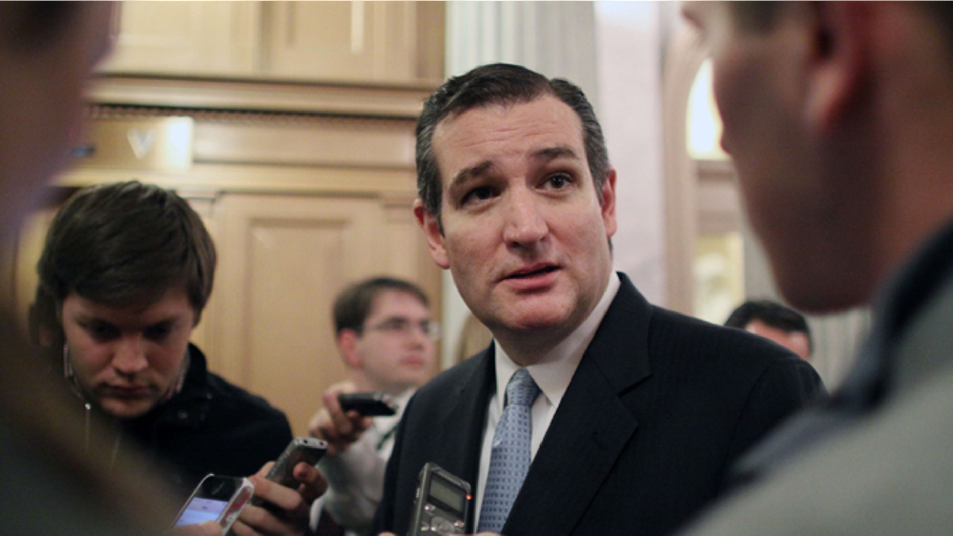 FILE - In this Dec. 13, 2014 file photo, Sen. Ted Cruz, R-Texas talks with reporters on Capitol Hill in Washington. Unhappy Republicans say Sen. Ted Cruz of Texas left a gift certificate good for confirmation of 12 judicial appointments for President Barack Obama and Democrats this holiday season. Only a month or so ago, voters delivered them a lump of coal in mid-term elections. (AP Photo/Lauren Victoria Burke, File)