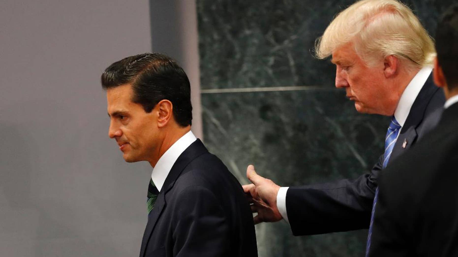 FILE - In this Aug. 31, 2016, file photo, Republican presidential nominee Donald Trump walks with Mexico's President Enrique Pena Nieto at the end of their joint statement at Los Pinos, the presidential official residence, in Mexico City. President Pena Nieto said Sunday, Oct. 23, that he could have done a better job handling the controversial meeting with the Republican candidate. (AP Photo/Dario Lopez-Mills, File)