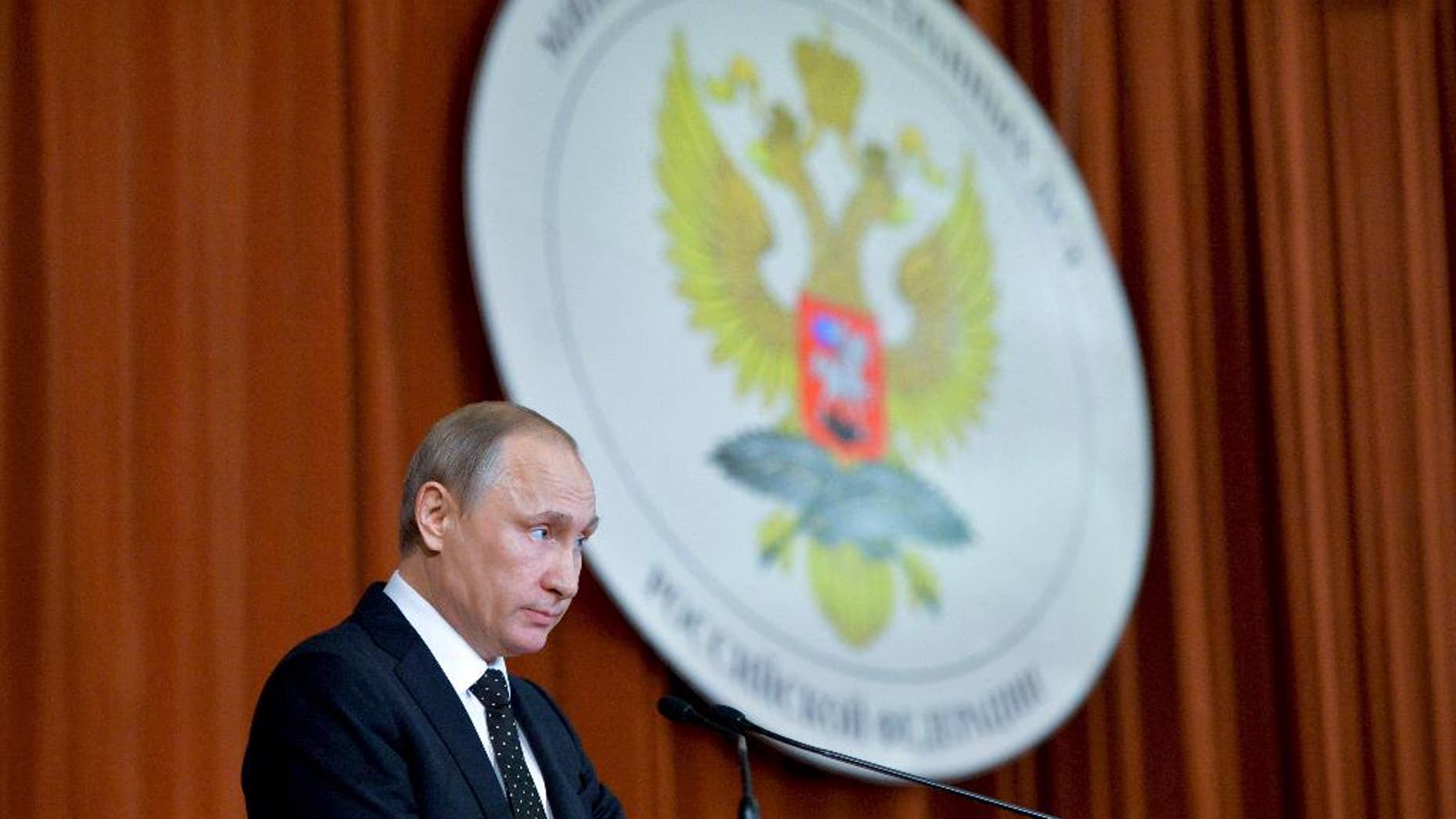 Russian President Vladimir Putin speaks during his meeting with Russian Ambassadors in Moscow, Russia, Thursday, June 30, 2016.Putin said that Russia will respond to NATO's military buildup near its borders, but will not be drawn into an arms race. (Alexei Druzhinin, Sputnik, Kremlin Pool Photo via AP)