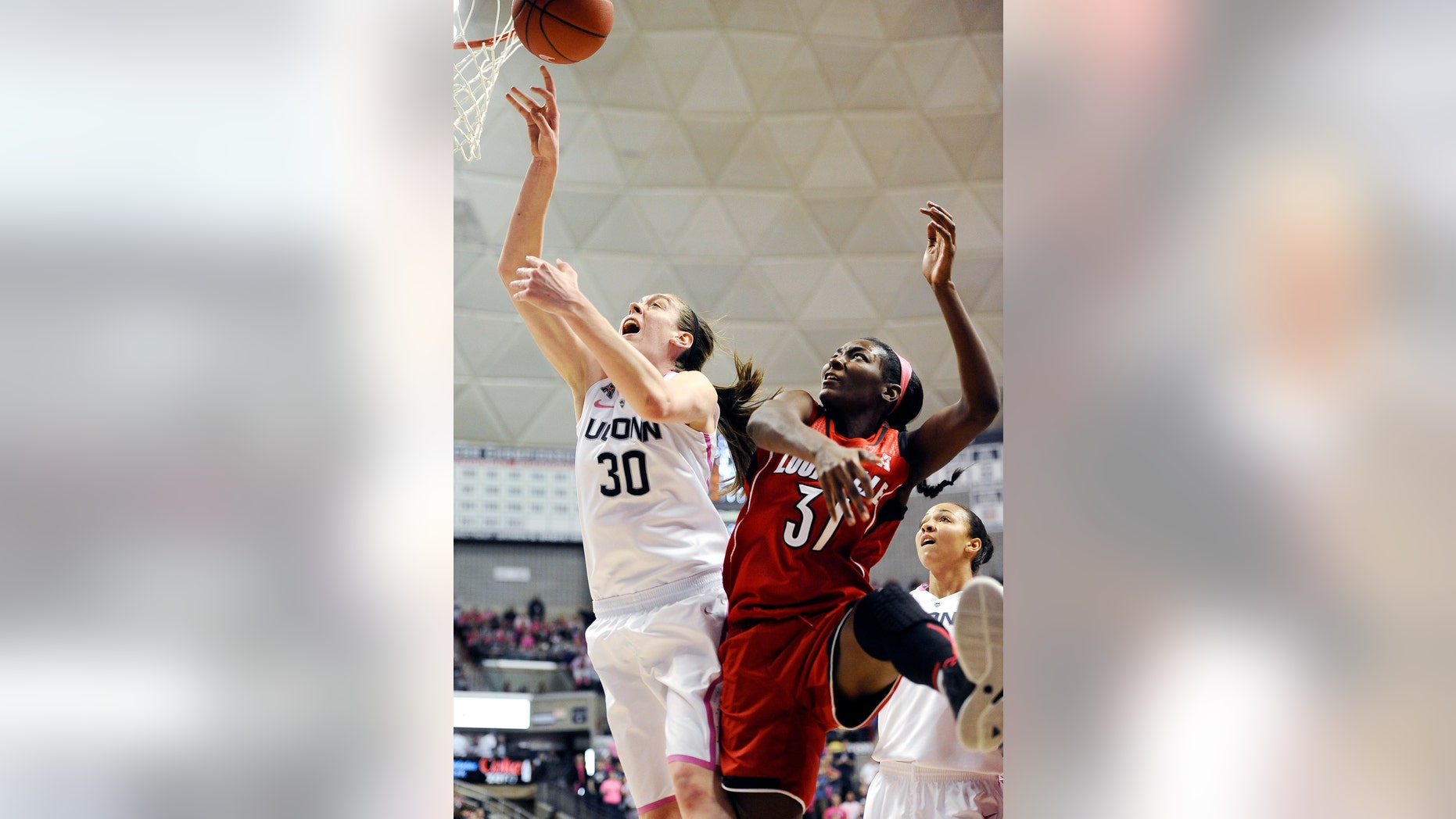 Connecticut's Breanna Stewart, left, and Louisville's Asia Taylor, battle for a rebound during the second half of an NCAA women's college basketball game, Sunday, Feb. 9, 2014, in Storrs, Conn. Connecticut won 81-64. (AP Photo/Jessica Hill)