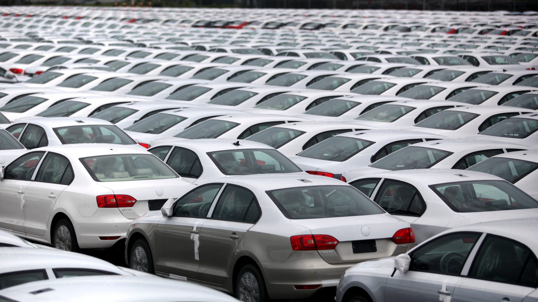 FILE - In this Sept. 19, 2013 file photo, Volkswagen Jettas produced in Mexico for export are parked at the port terminal in the Gulf city of Veracruz, Mexico. Mexico is on track to replace Japan as the second-largest exporter of cars to the United States by the end of 2014, and is expected to surpass Canada for the top spot by the end of 2015. (AP Photo/Felix Marquez, File)