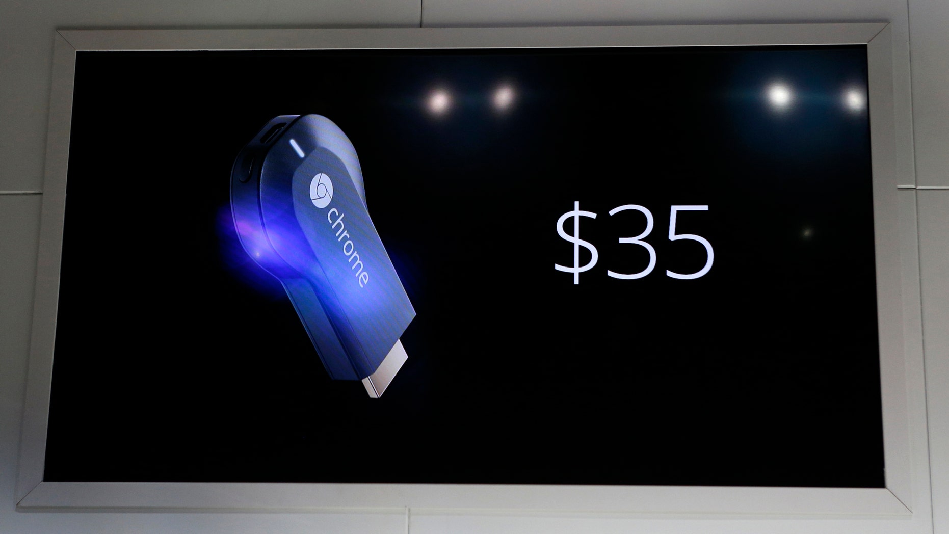 File photo: The new Google Chromecast dongle is pictured on an electronic screen as it is announced during a Google event at Dogpatch Studio in San Francisco, California, July 24, 2013. (REUTERS/Beck Diefenbach)