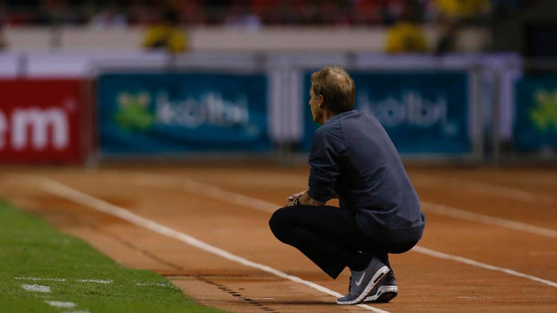 United States coach Jurgen Klinsmann watches the game on the sideline during a 2018 World Cup qualifying soccer match against Costa Rica, in San Jose, Costa Rica, Tuesday, Nov. 15, 2016. United States lost 4-0 to Costa Rica. (AP Photo/Moises Castillo)