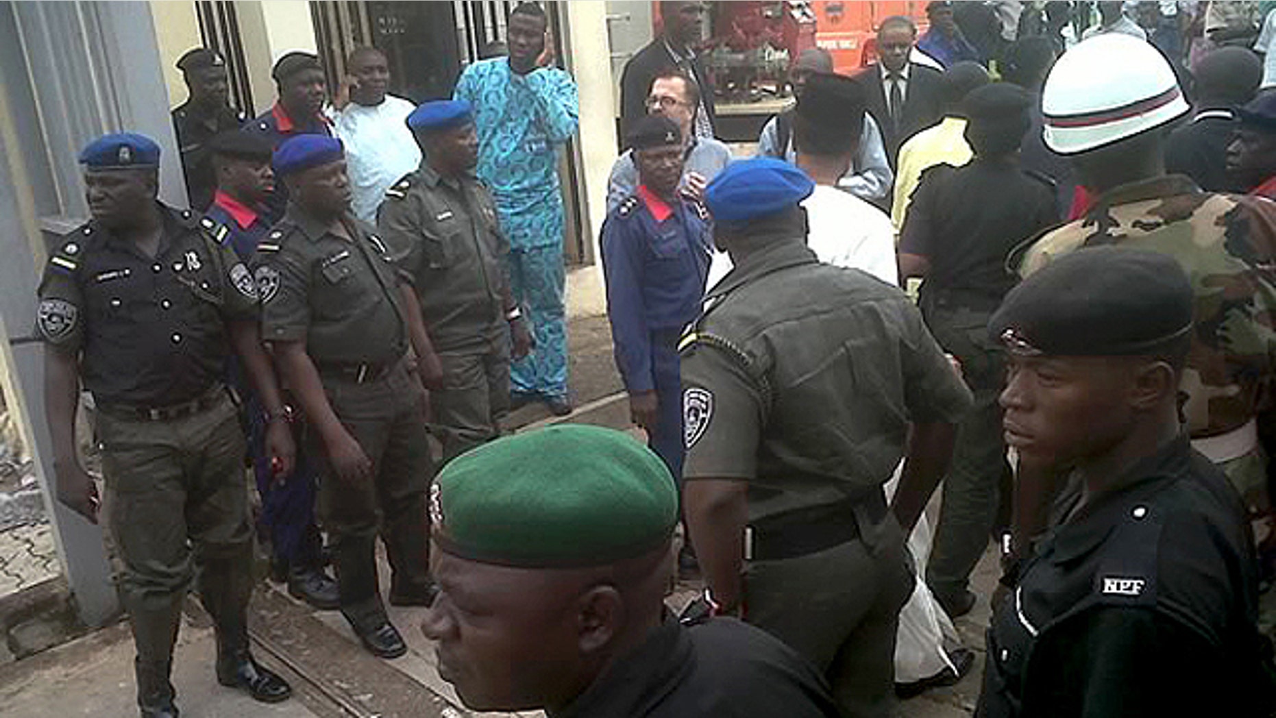 Aug. 26: This image released by Saharareporters shows police and rescue workers after a large explosion struck the United Nations' main office in Nigeria's capital Abuja, flattening one wing of the building and killing several people. A U.N. official in Geneva called it a bomb attack. The building, located in the same neighborhood as the U.S. embassy and other diplomatic posts in Abuja, had a huge hole punched in it.
