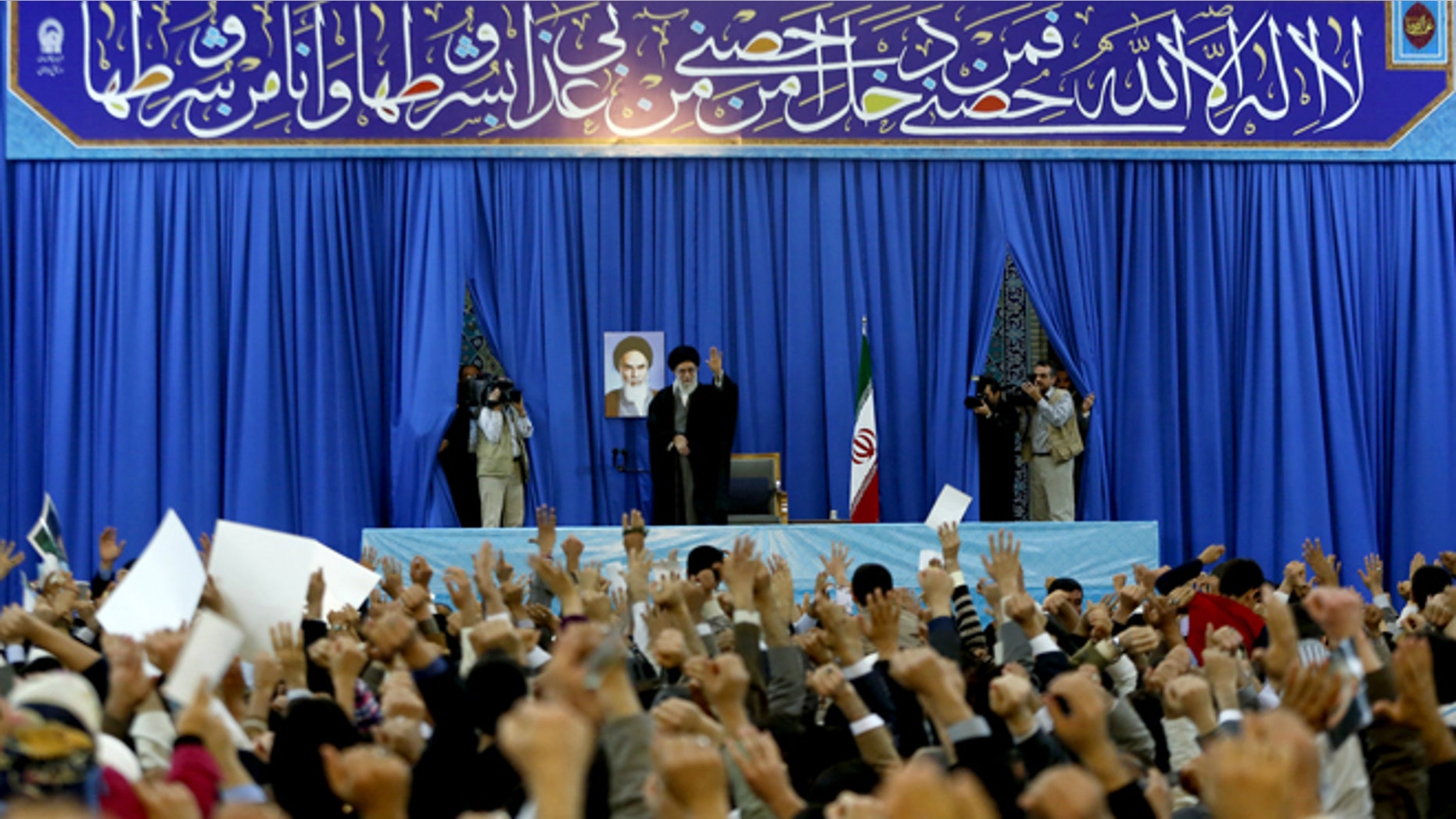 In this photo released by an official website of the Iranian supreme leader's office on Thursday, March 21, 2013, Iran's Supreme Leader Ayatollah Ali Khamenei waves to a crowd in northeastern Iran on the first day of the new Persian calendar year.