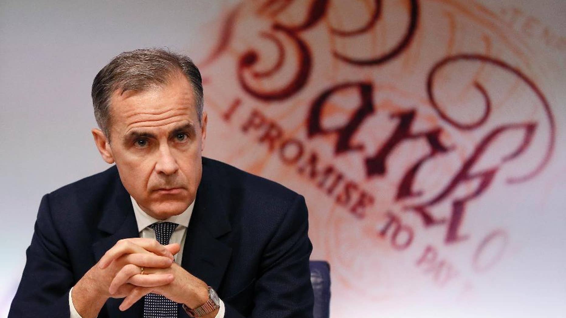 FILE - In this Thursday, Feb. 2, 2017 file photo, Mark Carney, Governor of the Bank of England listens during a quarterly Inflation Report press conference at the bank in London. The Bank of England has kept its key interest rate at a record-low 0.25 percent to avoid slowing economic growth as Britain prepares to leave the European Union. The bank’s Monetary Policy Committee voted Thursday, March 16 to keep its key rate on hold for an eighth straight month, a day after the U.S. Federal Reserve raised its benchmark rate. (AP Photo/Kirsty Wigglesworth, file)