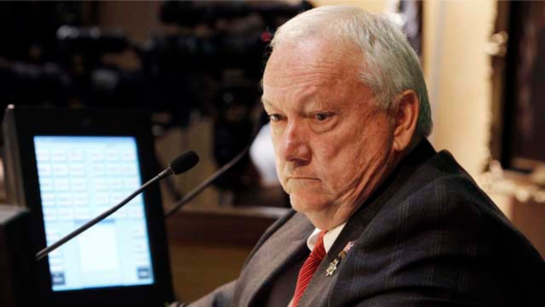 Arizona Senate President Russell Pearce, R-Mesa, watches the votes tally to adjourn during a special session in the senate chambers at the capitol in Phoenix.
