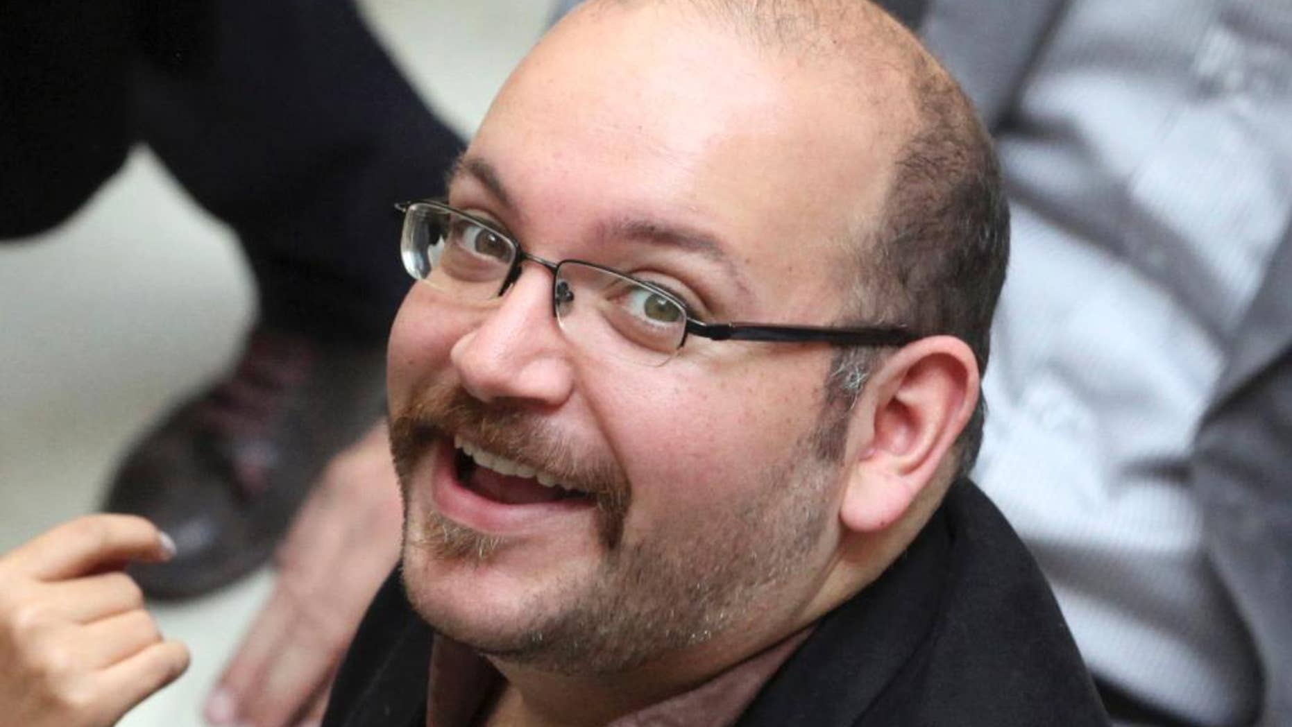 FILE - In this photo April 11, 2013 file photo, Jason Rezaian, an Iranian-American correspondent for the Washington Post, smiles as he attends a presidential campaign of President Hassan Rouhani, in Tehran, Iran. The lawyer of the detained Washington Post journalist charged with espionage in Iran said Monday, July 20, 2015 that the next hearing in his trial likely will be the last.(AP Photo/Vahid Salemi, File)