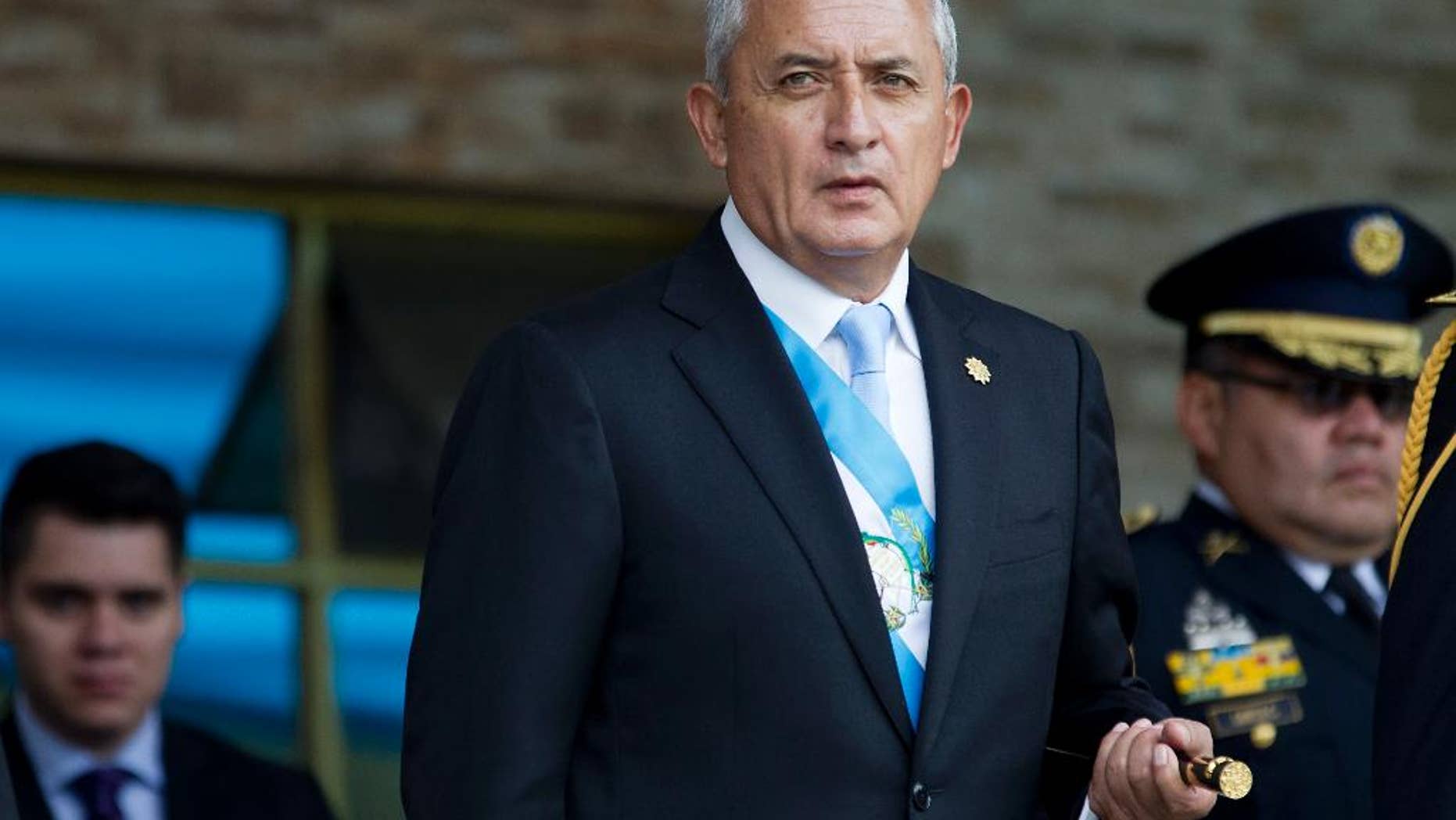 FILE - In this June 30, 2015, file photo, Guatemala's President Otto Perez Molina arrives to the Army general headquarters for the Army Day parade in Guatemala City. An attempt to withdraw Perez Molina's immunity from prosecution died in Congress on Thursday, Aug. 13, 2015, following a string of corruption scandals that sparked large protests. (AP Photo/Moises Castillo, File)