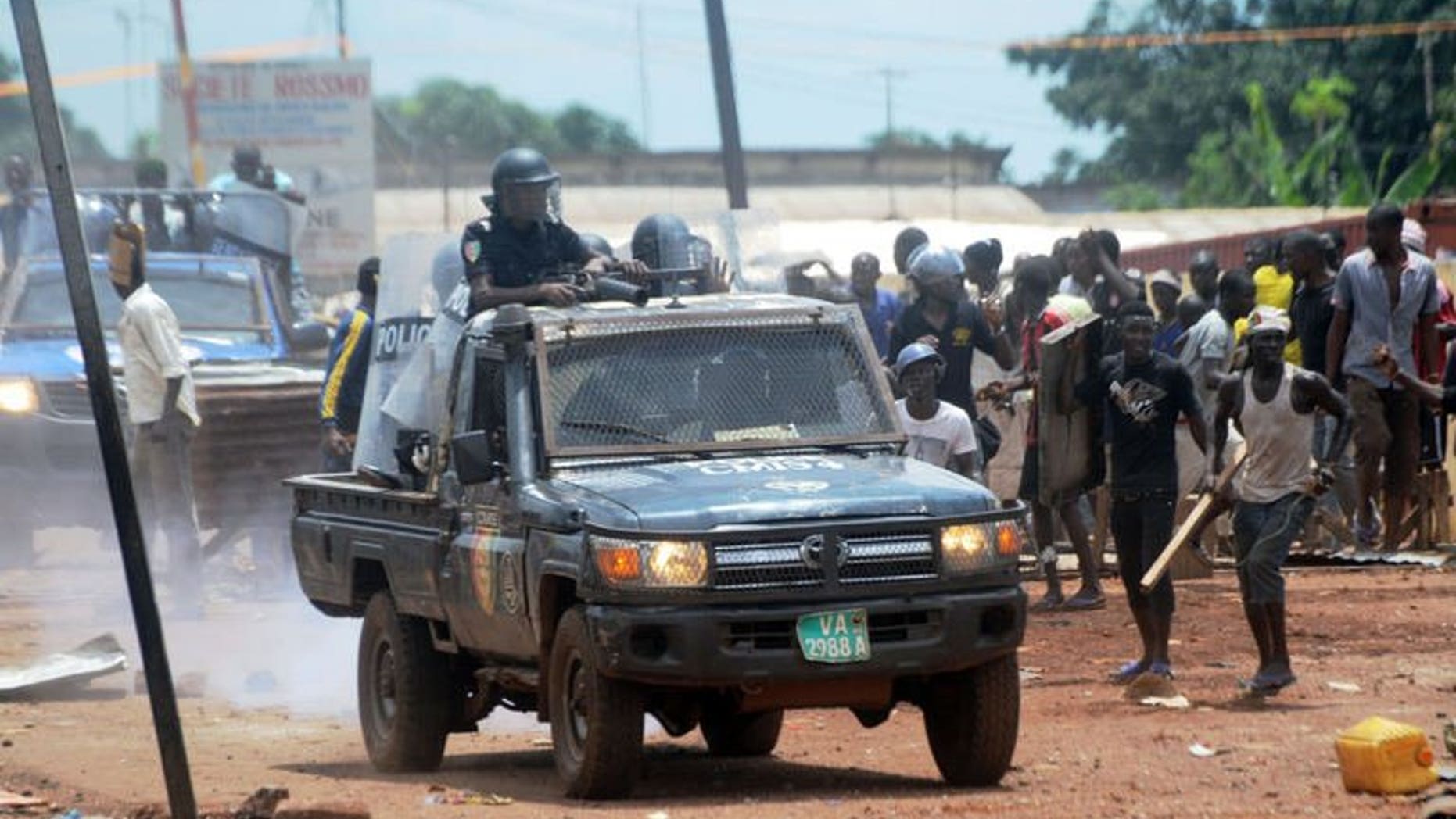 A Guinean police vehicle patrols as protesters clash with the police on September 23, 2013 in Conakry.