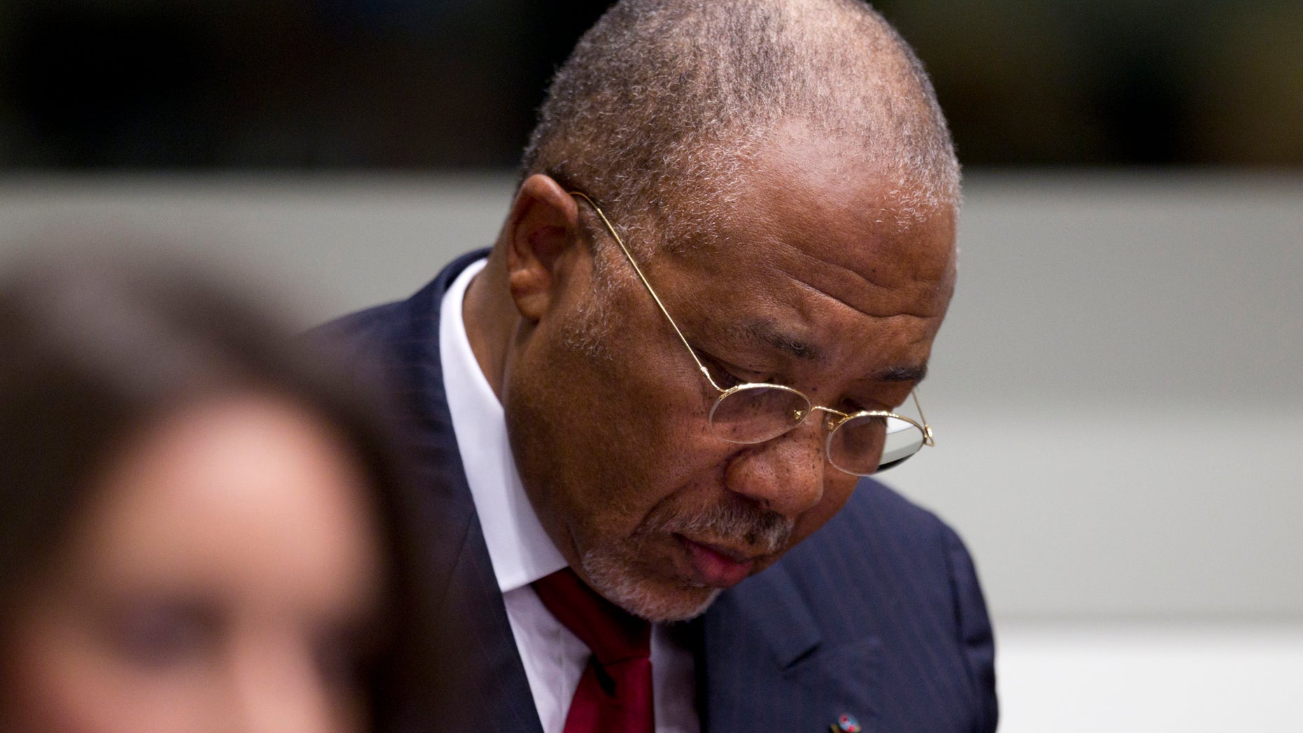 April 26: Former Liberian President Charles Taylor looks down as he waits for the start of a hearing to deliver verdict in the court room of the Special Court for Sierra Leone in Leidschendam, near The Hague, Netherlands.