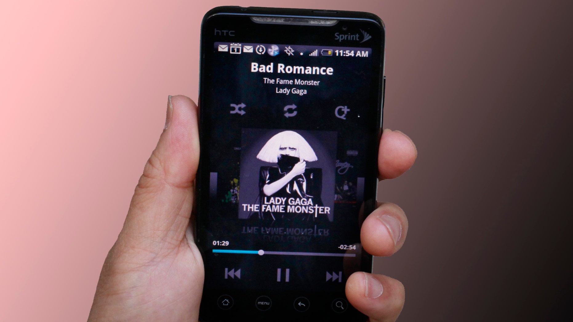 Ed Ho of mSpot listens to the song, "Bad Romance," to a Lady GaGa album, "The Fame Monster," using the new music service from his phone in Palo Alto, Calif., Monday, June 28, 2010. The new music service launching Monday lets you listen to your music collection from any computer or Android phone over the Web. MSpot's service stores your music on its computers and lets you access it remotely through a Web browser. (AP Photo/Paul Sakuma)