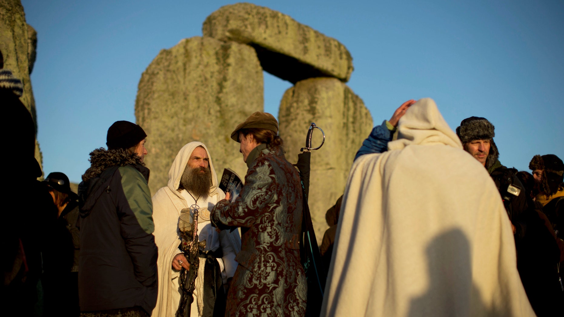 December 21, 2012: A Druid stands after sunrise at the old stone circle of Stonehenge.