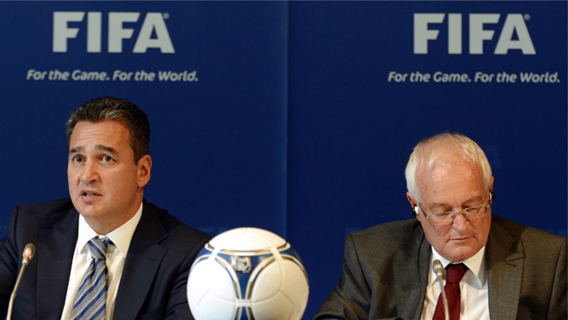 FILE - In this Friday, July 27, 2012 file photo, Chairmen of the two chambers of the new FIFA Ethics Committee Michael Garcia, left, from the US and Joachim Eckert, right, from Germany attend a press conference, at the Home of FIFA in Zurich, Switzerland. FIFA ethics judge Joachim Eckert is unlikely to reach final decisions in the 2018 and 2022 World Cup bidding corruption probe until early next year. FIFA has cleared Russia and Qatar of any wrongdoing in their winning bids for the next two World Cups. German judge Joachim Eckert formally closed FIFAs probe into the 2018 and 2022 World Cup bidding contests on Thursday, almost four years after the vote by the governing body's scandal-tainted executive committee. Eckert noted wrongdoing among the 11 bidding nations in a 42-page summary of FIFA prosecutor Michael Garcias investigations. (AP Photo/Keystone, Walter Bieri, File)