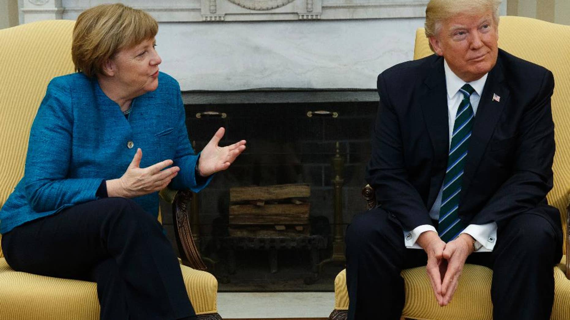 President Donald Trump meets with German Chancellor Angela Merkel in the Oval Office of the White House in Washington, Friday, March 17, 2017. (AP Photo/Evan Vucci)