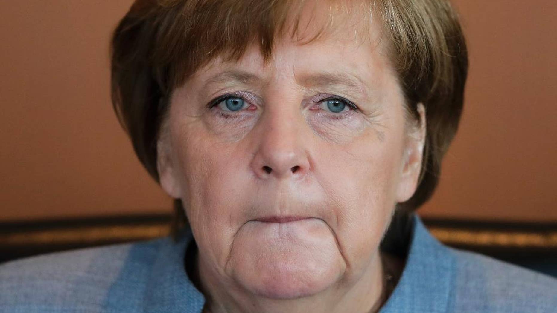 German Chancellor Angela Merkel attends the weekly cabinet meeting of the German government at the chancellery in Berlin, Germany, Wednesday, April 26, 2017. (AP Photo/Markus Schreiber)