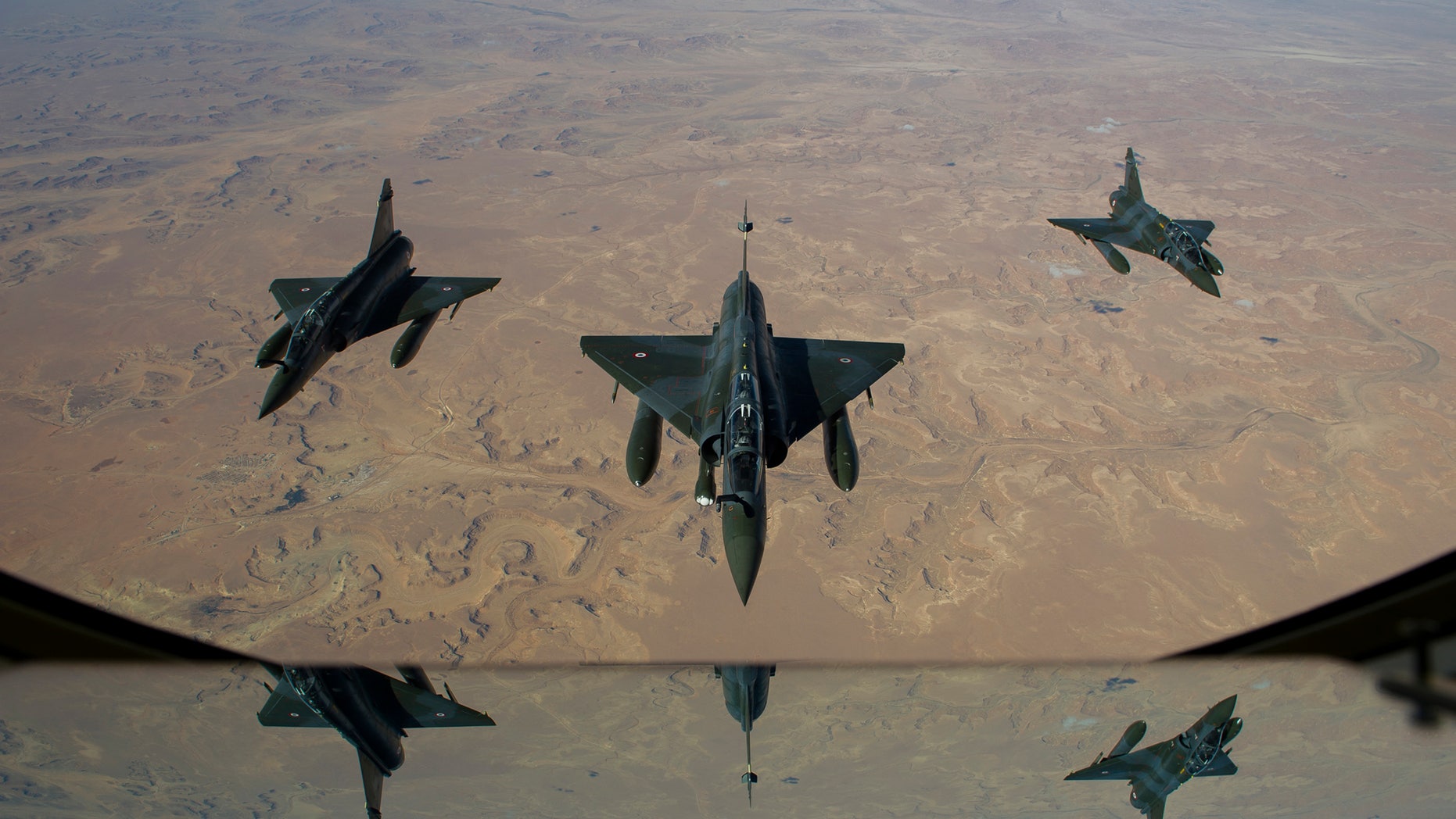 This picture released by the French Army Communications Audiovisual office (ECPAD) shows French Mirage 2000 D aircraft flying to N'Djamena overnight January 11 to 12, after taking off from the French military base of Nancy. The battle to retake Mali's north from the al-Qaida-linked groups controlling it began in earnest Saturday, after hundreds of French forces deployed to the country and began aerial bombardments to drive back the Islamic extremists from a town seized earlier this week. (AP Photo/ R.Nicolas-Nelson, Ecpad)