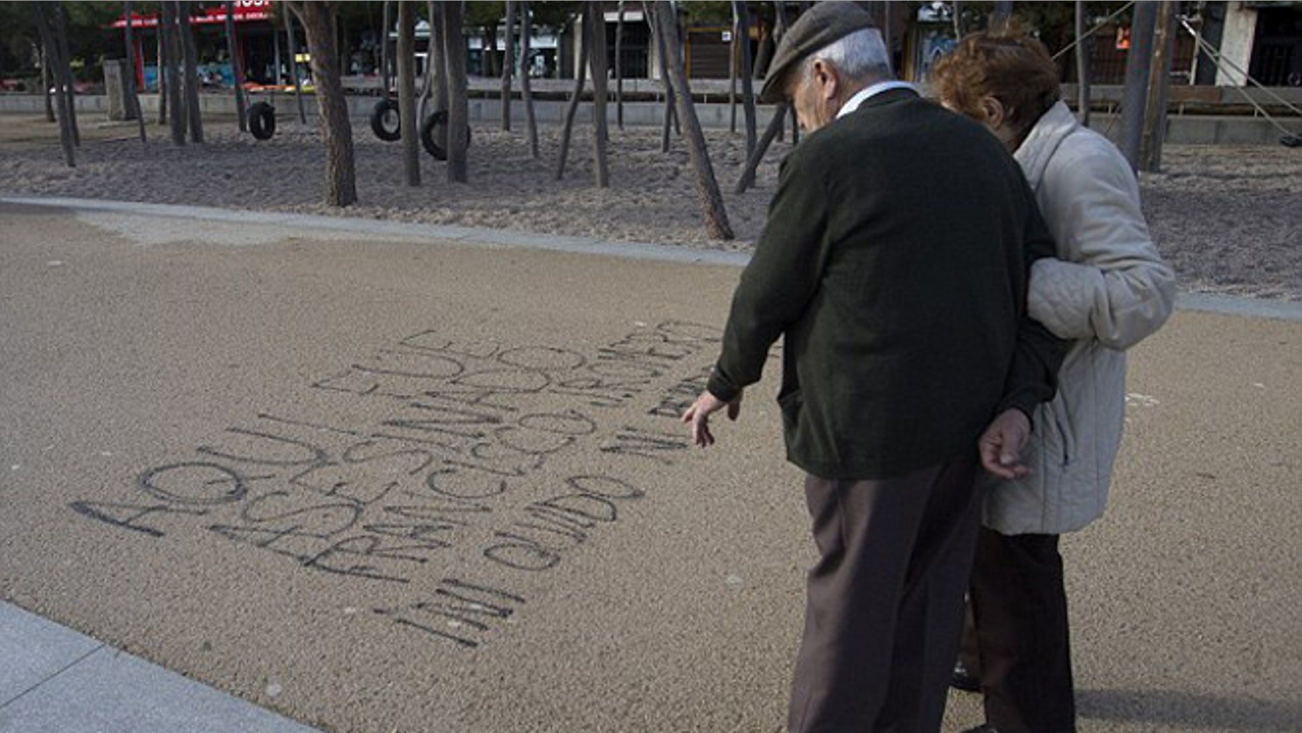 Graffiti reading, "Here Francisco Romero was killed. I don't forget; I don't forgive." (Photo: AP)