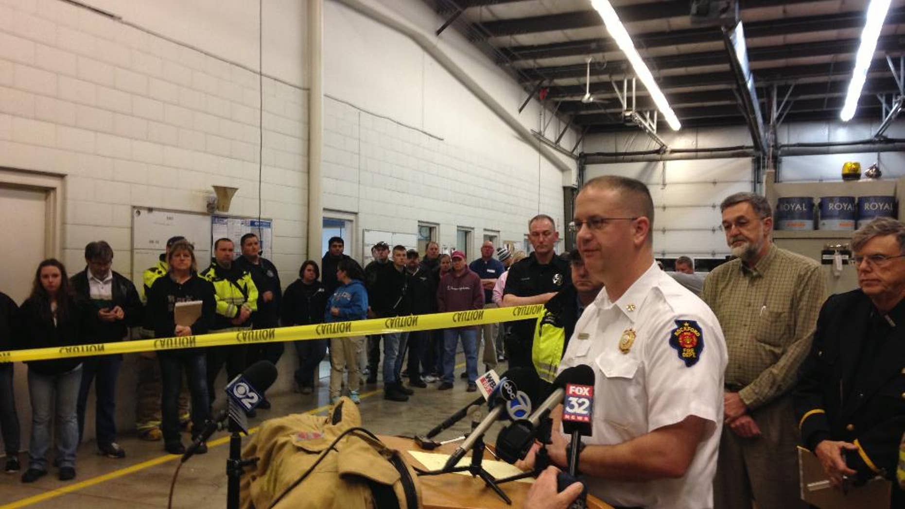 Rockford Fire Department Division Chief Matthew Knott speaks Friday April 10, 2015 at a news conference in Kirkland Illinois about the tornado that hit the small community of Fairdale Illinois on Thursday. Knott said one person, a 67-year-old woman, died and seven people were injured. The tornado impacted all of the roughly 50 homes in Fairdale, destroying many of them. (AP Photo/Sara Burnett)