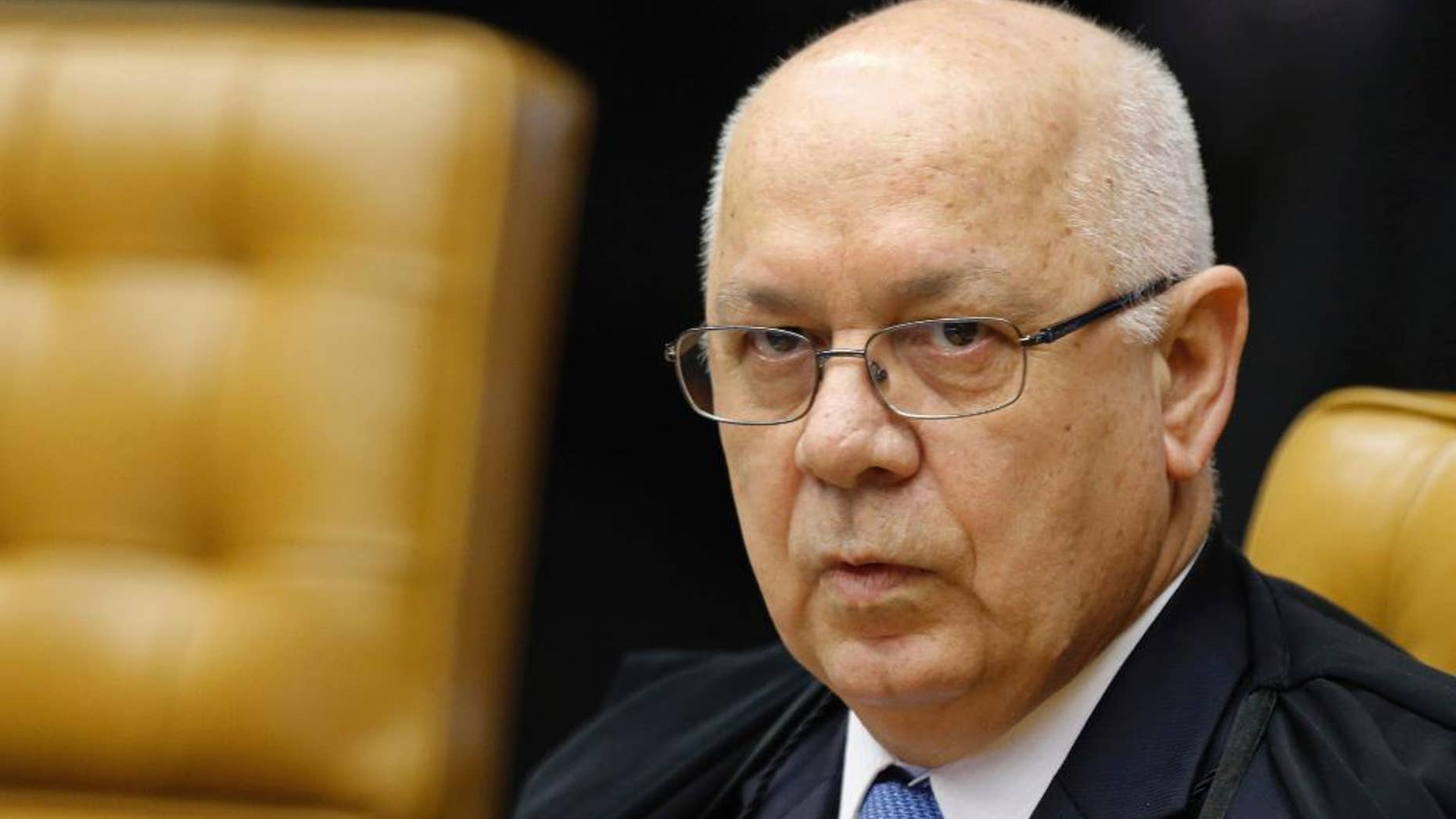 FILE- In this March 4, 2015, file photo, Brazil's Supreme Court Justice Teori Zavascki attends a session of the Supreme Court in Brasilia, Brazil. Zavascki's son said that his father was on a plane that crashed off the coast of the city in Rio de Janeiro, Thursday, Jan. 19, 2017. (AP Photo/Eraldo Peres, File)