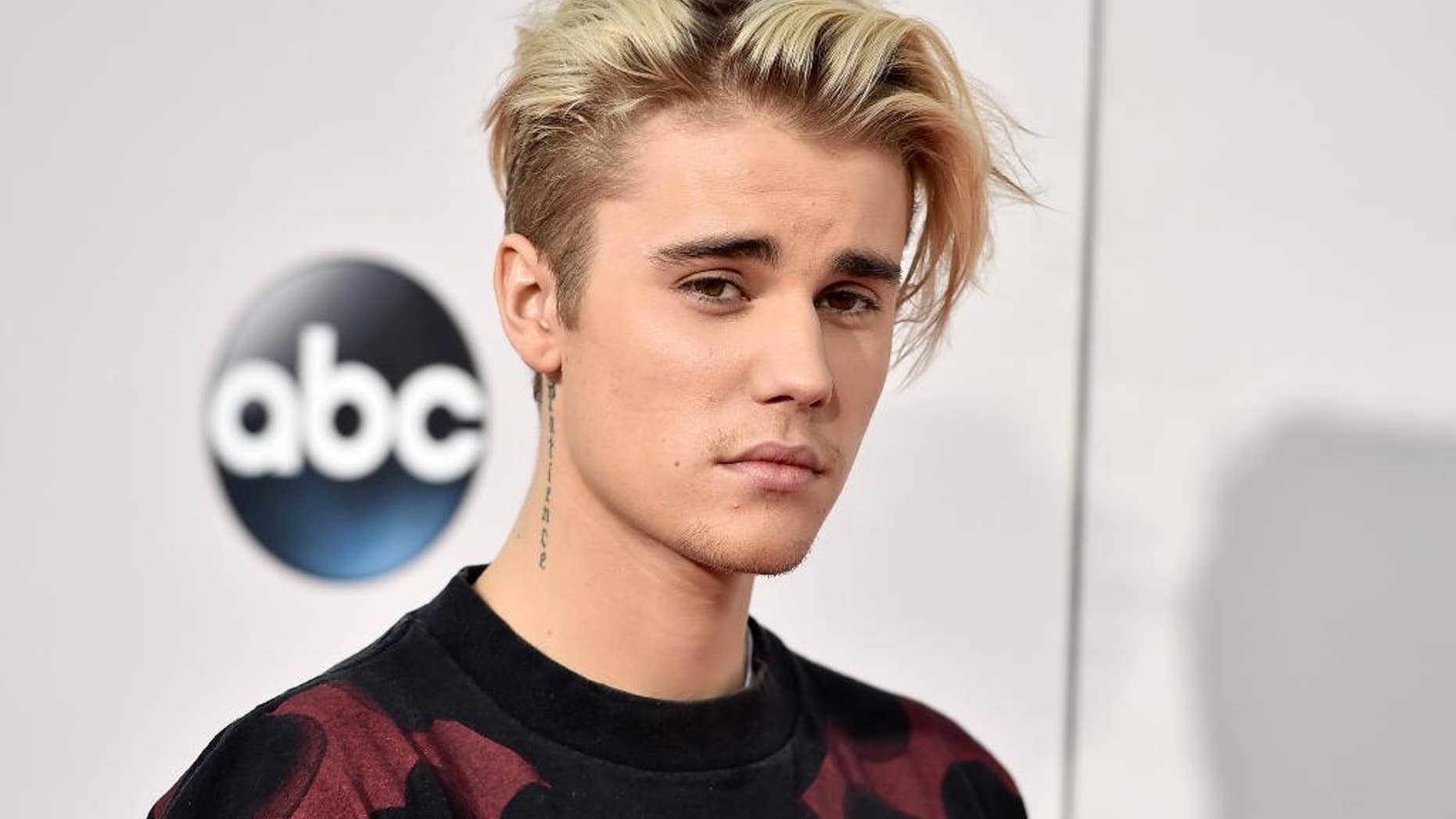 FILE - In this Nov. 22, 2015 file photo, Justin Bieber arrives at the American Music Awards at the Microsoft Theater in Los Angeles. Bieber threatened to go private on Instagram in a post on August 13, 2016, after getting negative comments from fans of ex-girlfriend Selena Gomez. (Photo by Jordan Strauss/Invision/AP, File)