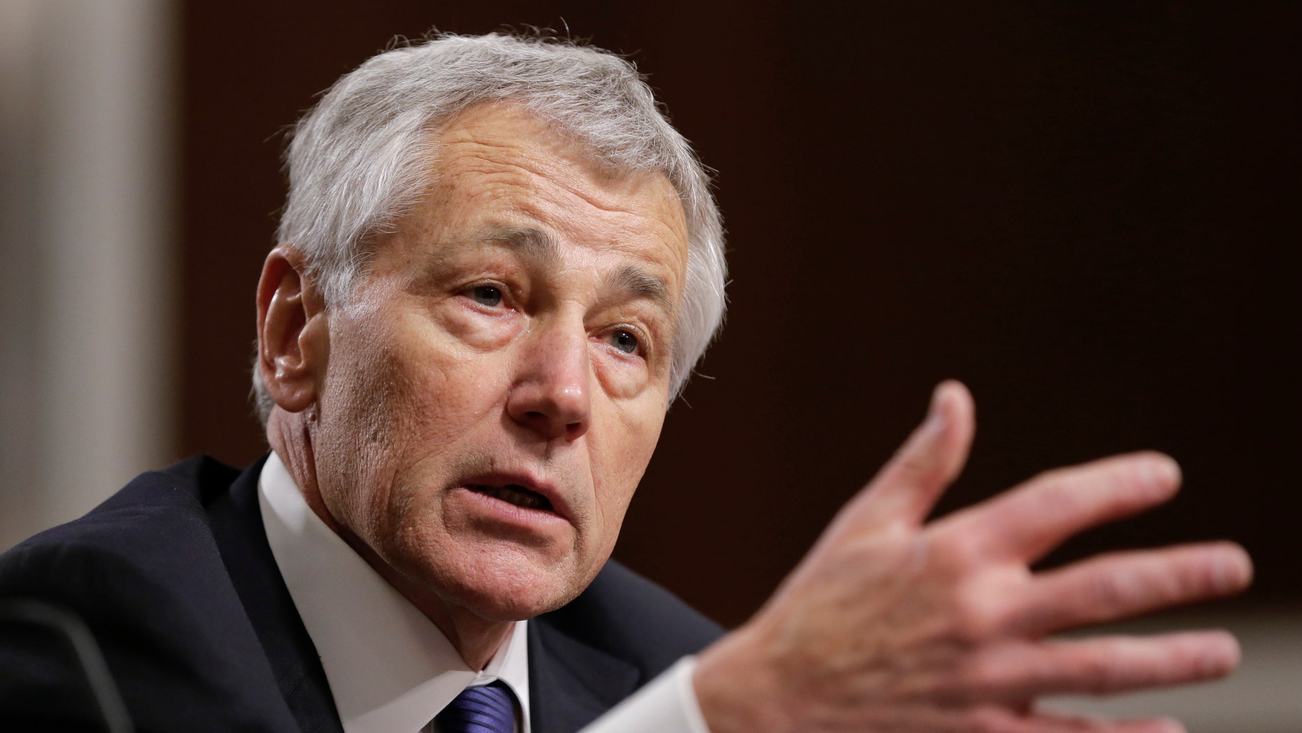 FILE - In this Jan. 31, 2013 file photo, former Nebraska Republican Sen. Chuck Hagel testifies on Capitol Hill in Washington before the Senate Armed Services Committee confirmation hearing. When President Barack Obama declared Hagel would be the first former enlisted man to lead the Pentagon, he seemed to overlook four previous defense chiefs who served at least part of their military years as enlisted men. (AP Photo/J. Scott Applewhite, File)