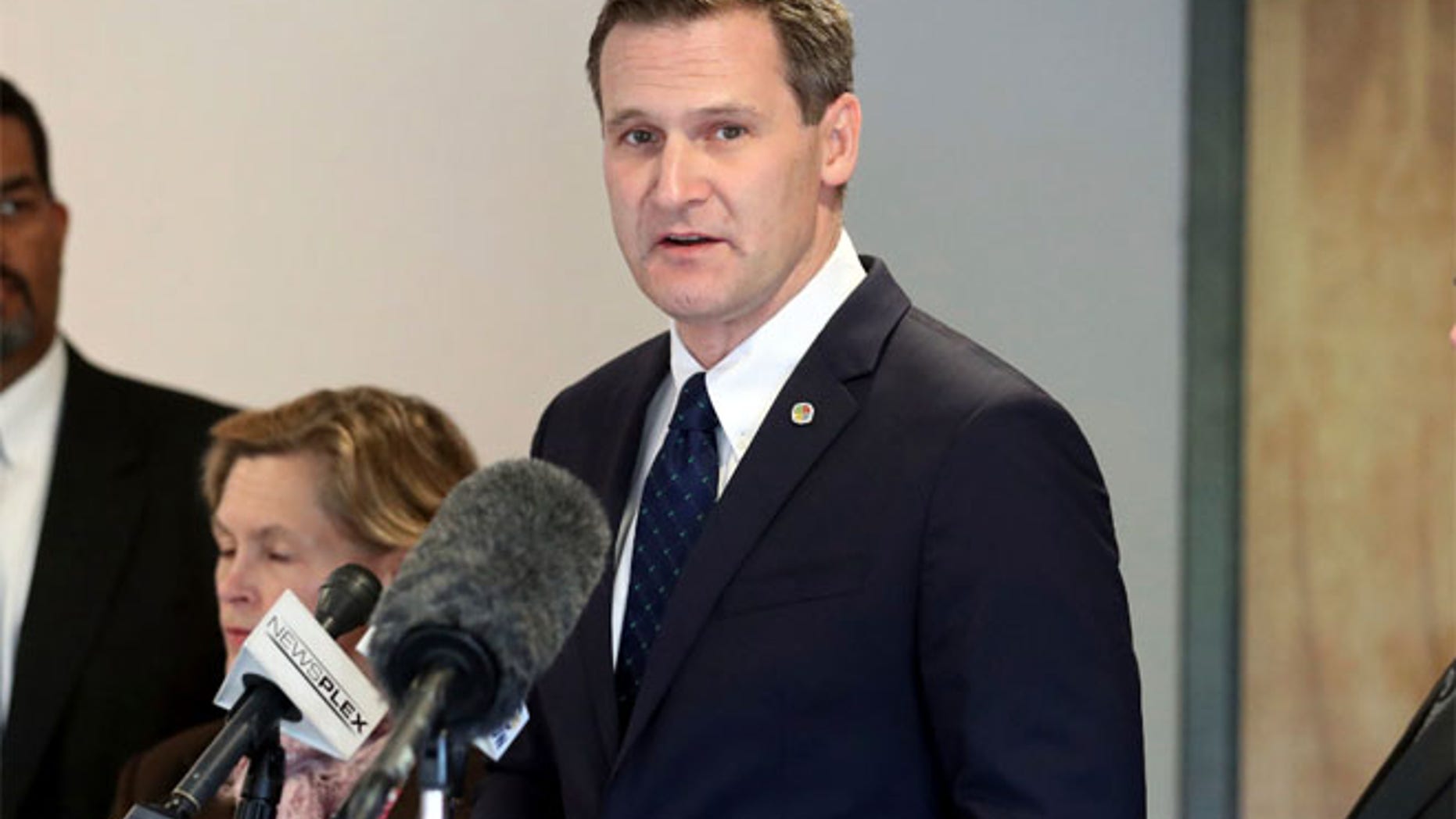 FILE 2016: Charlottesville Mayor Mike Signer, center, during a press conference.