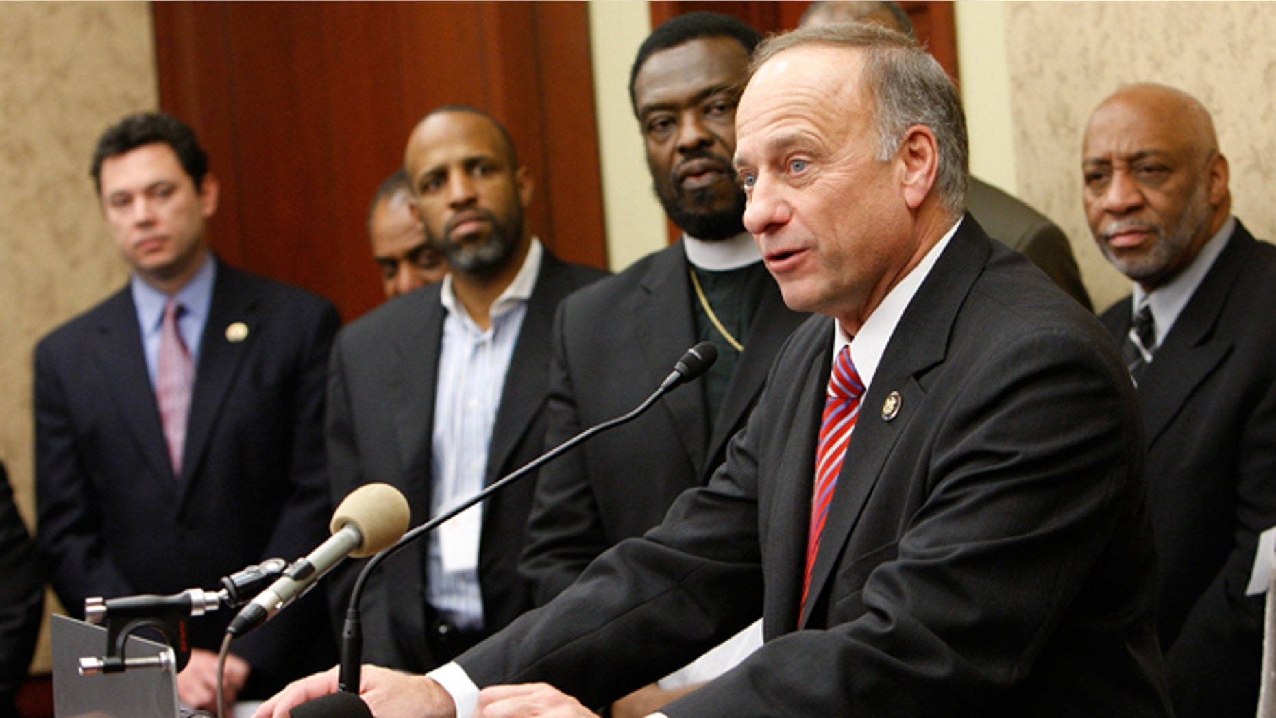 WASHINGTON - JANUARY 12: U.S. Rep. Steve King (R-IA) speaks as Bishop Harry Jackson (4th L), senior pastor of Hope Christian Church and Chairman of the Stand4MarriageDC.com Coalition, listens during a news conference on Capitol Hill January 12, 2010, in Washington, DC. The coalition held a news conference to discuss strategies in saving traditional marriage and to call on congressional members to continue to support it. (Photo by Alex Wong/Getty Images) *** Local Caption *** Harry Jackson;Steve King