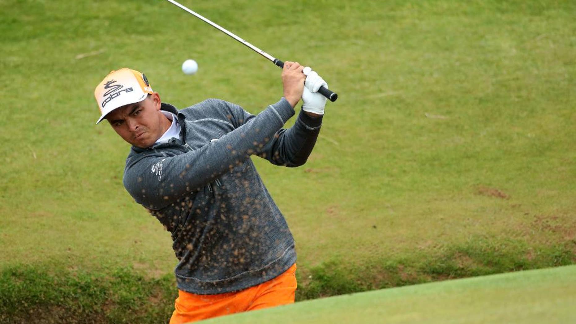 Rickie Fowler of the United States play out of a bunker on the 8th green during the final round of the British Open Golf Championship at the Royal Troon Golf Club in Troon, Scotland, Sunday, July 17, 2016. (AP Photo/Peter Morrison)