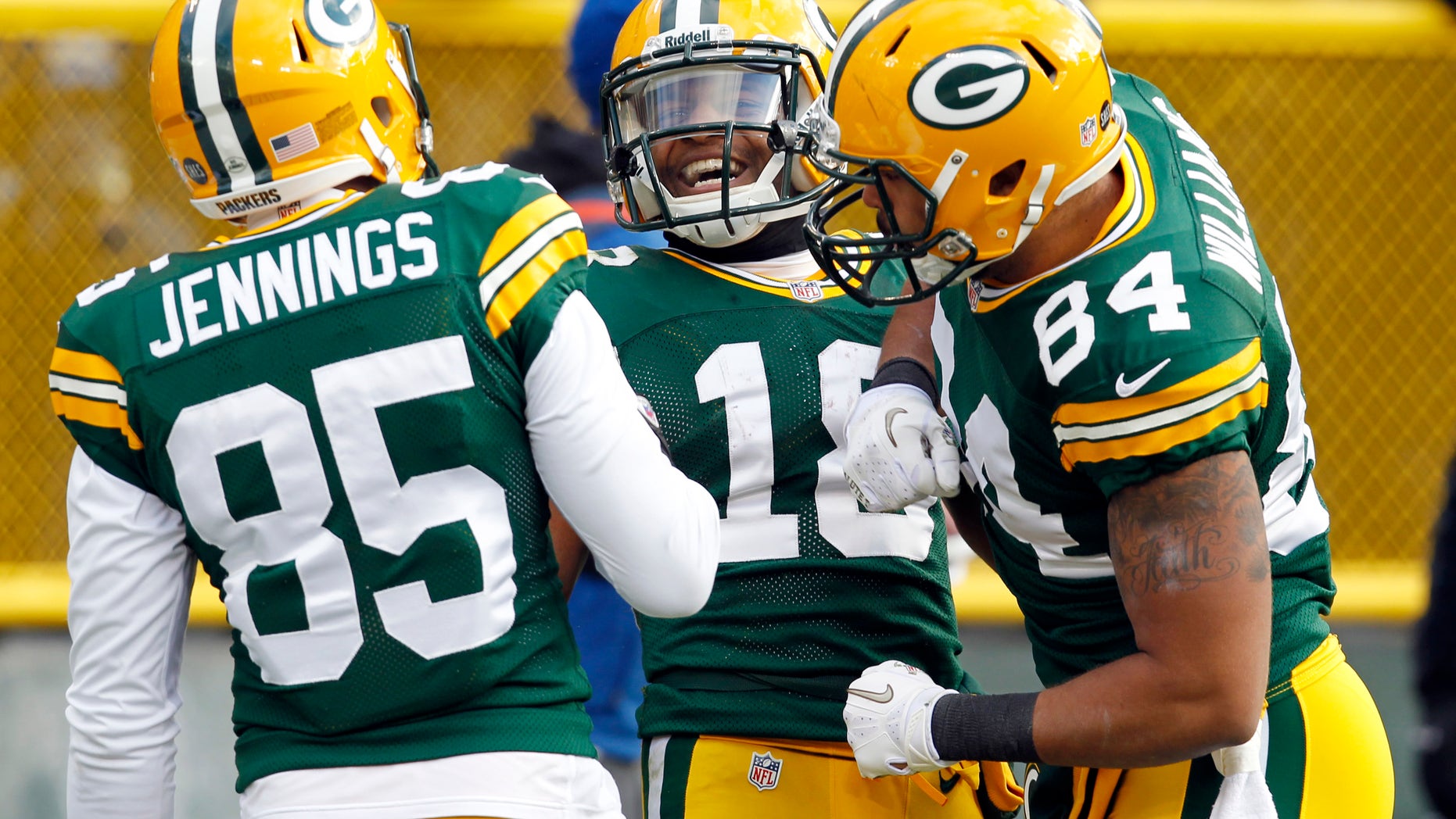 Green Bay Packers' Randall Cobb (18) celebrates with Greg Jennings and D.J. Williams after Cobb caught a touchdown pass during the first half of an NFL football game Sunday, Dec. 23, 2012, in Green Bay, Wis. (AP Photo/Mike Roemer)