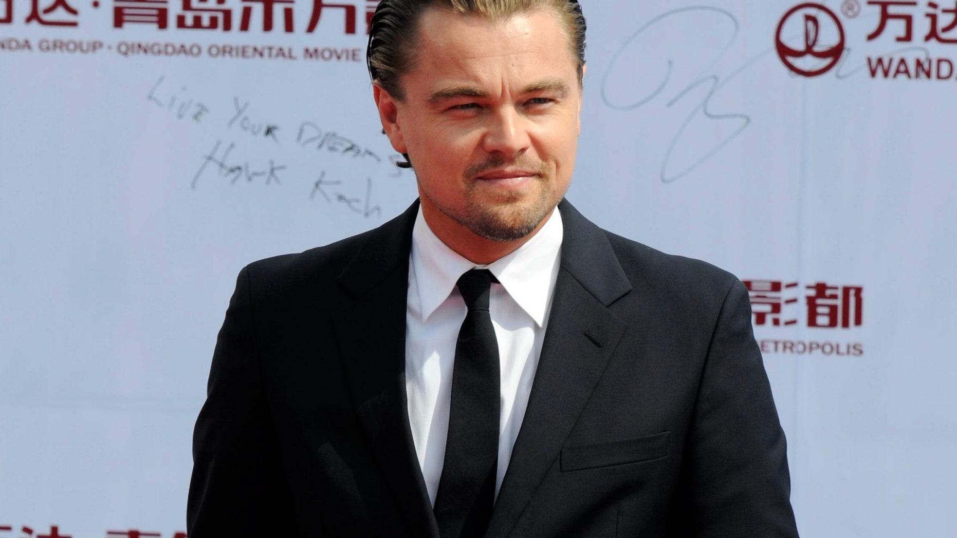 FILE - This Sept. 22, 2013 file photo shows actor Leonardo DiCaprio at the launching ceremony of Qingdao Oriental Movie "Metropolis" in Qingdao in east China's Shandong province. Venturi Automobiles announced Monday, Dec. 9, 2013, a joint venture with award-winning actor and environmental activist Leonardo DiCaprio to enter a team in the new FIA Formula E Championship - the world’s first fully-electric race series beginning in September 2014. (AP Photo, File)