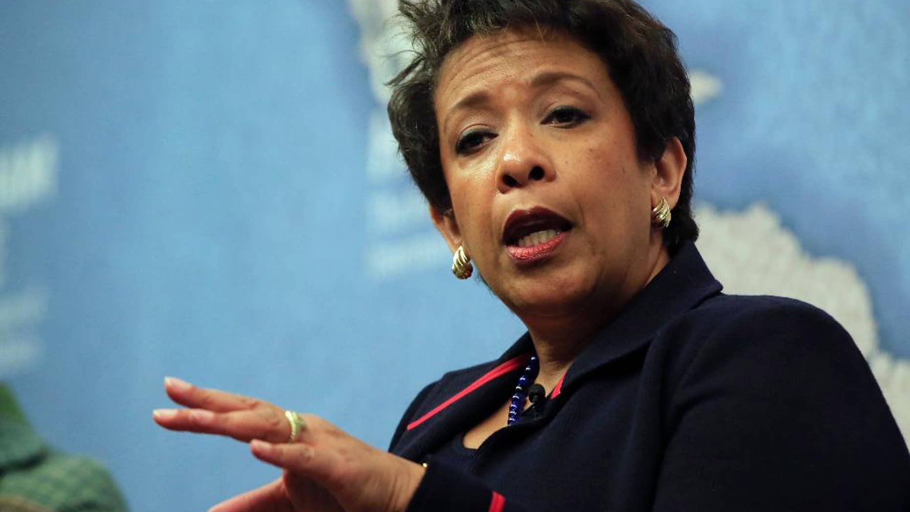 United States Attorney General Loretta Lynch gestures as she answers a question from the audience after speaking at Chatham House, The Royal Institute for International Affairs, in London, Wednesday, Dec. 9, 2015. (AP Photo/Alastair Grant)