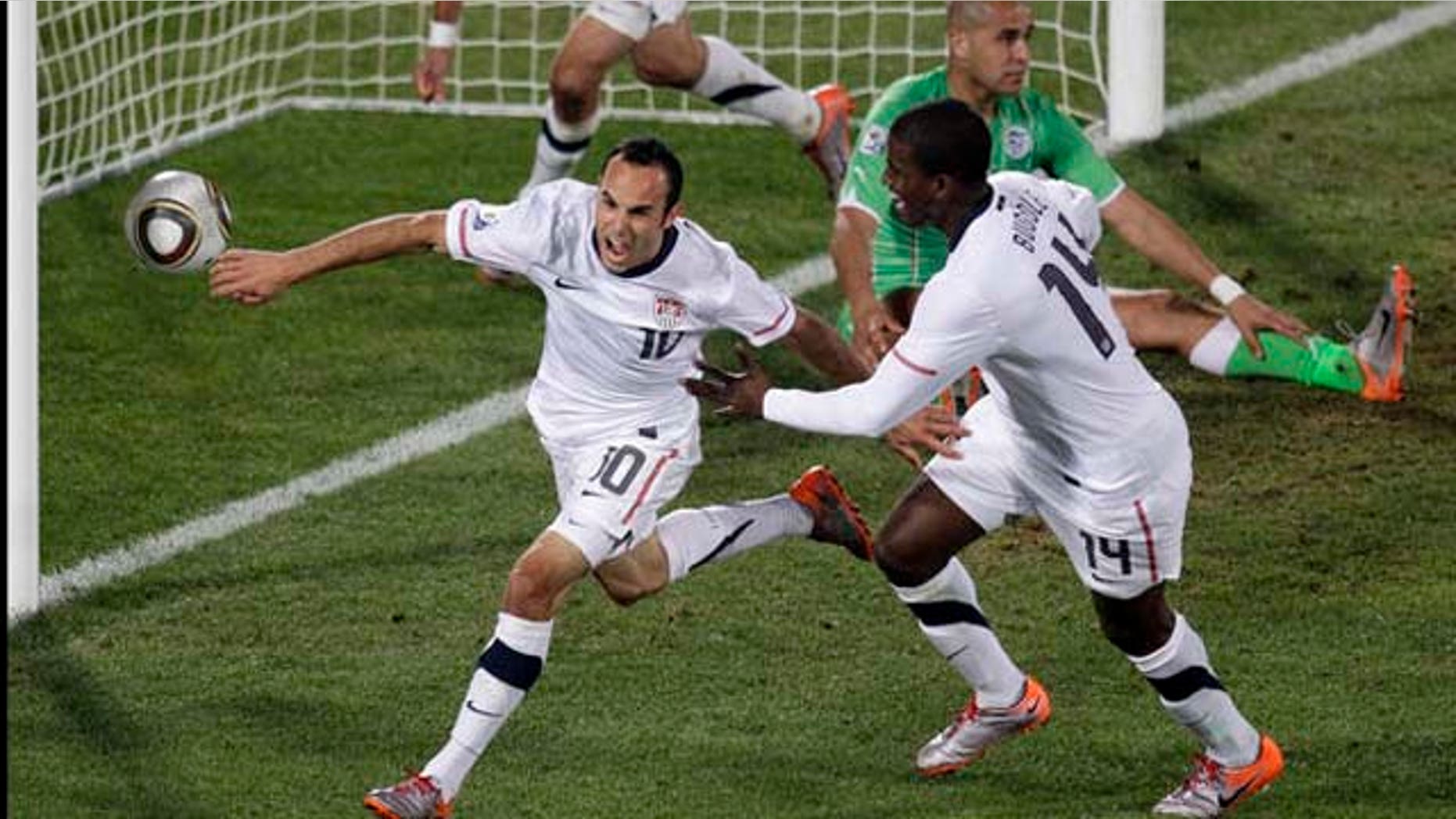 United States' Landon Donovan, front left, celebrates after scoring a goal with fellow team members United States' Clint Dempsey, back left, and United States' Edson Buddle, front right, during the World Cup group C soccer match between the United States and Algeria at the Loftus Versfeld Stadium in Pretoria, South Africa, Wednesday, June 23, 2010. (AP Photo/Michael Sohn)