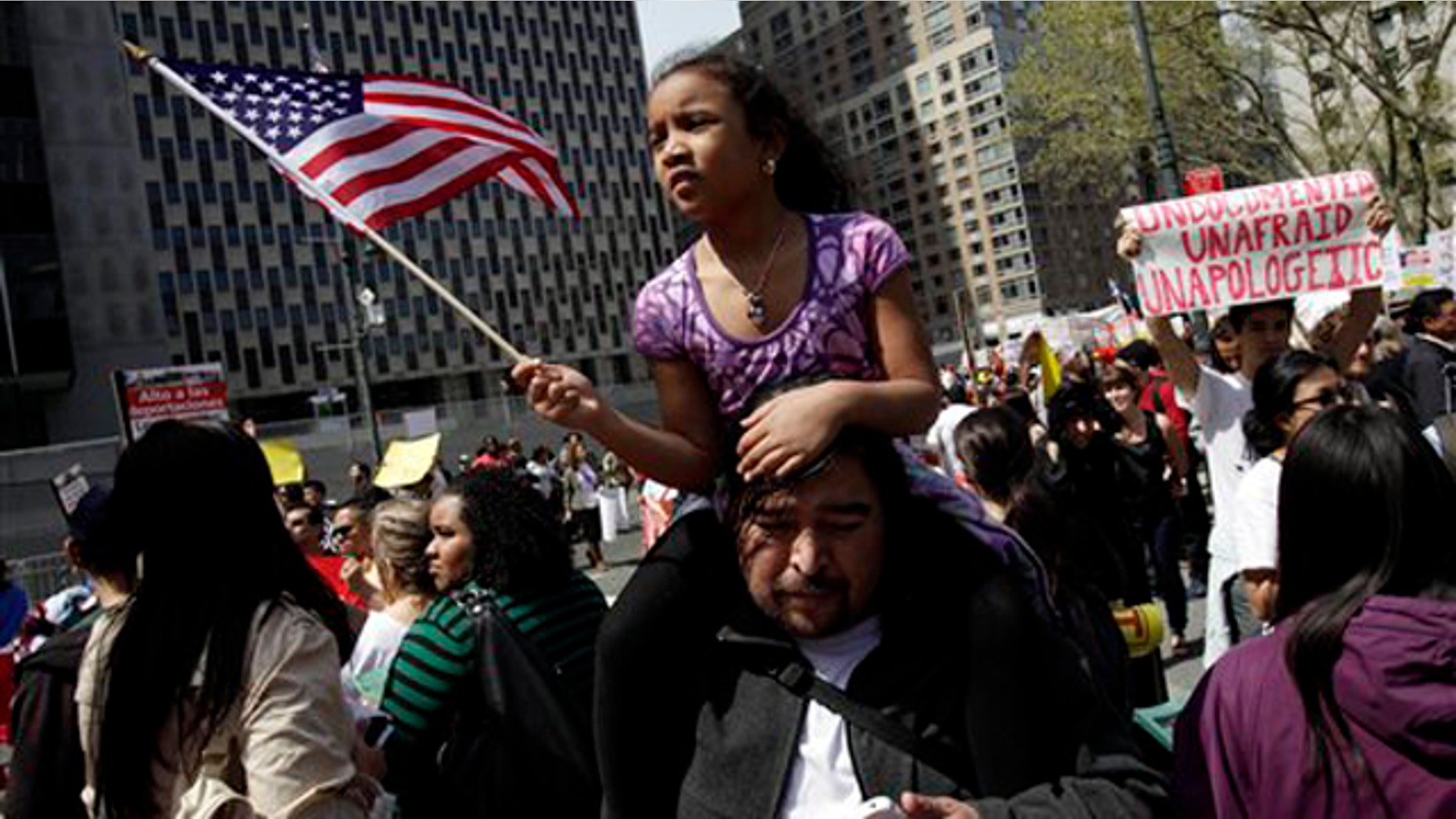 FILE - In this May 1, 2011 file photo, a girl waves an American flag while participating in a rally for jobs and immigration rights in New York. Nearly every state in the union decided to tackle immigration on its own this year in the absence of any federal action on the issue. But an Associated Press review of the data found that as of Wednesday nearly all of the punitive measures failed. (AP Photo/Seth Wenig, File)
