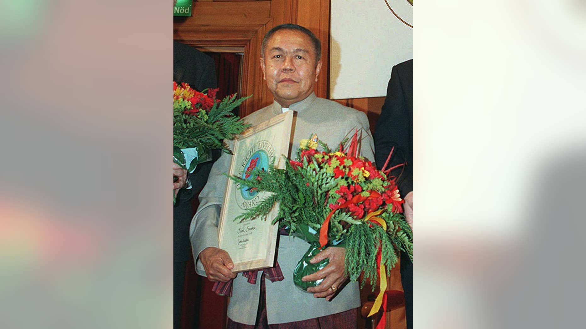 FILE - In this Dec. 8, 1995 file photo, Sulak Sivaraksa from Thailand poses for a photo during an award ceremony of the 1995 Right Livelihood Award, also called the "alternative Nobel Prize," in Stockholm, Sweden. Sulak, one of Thailand’s most prominent intellectuals, is the target of a criminal complaint for comments he made about a Thai king who died more than 400 years ago, Police Col. Thiravit Busaban said Saturday, Oct. 18, 2014. Eighty-two-year-old Sulak was cited by two retired senior army officers on charges of lese majeste, or insulting the monarchy. If convicted, he could be imprisoned for up to 15 years. In Thailand, anyone can file a lese majeste complaint with police, and the charge has frequently been used as a weapon to harass political enemies. (AP Photo/Eric Roxfelt, File)