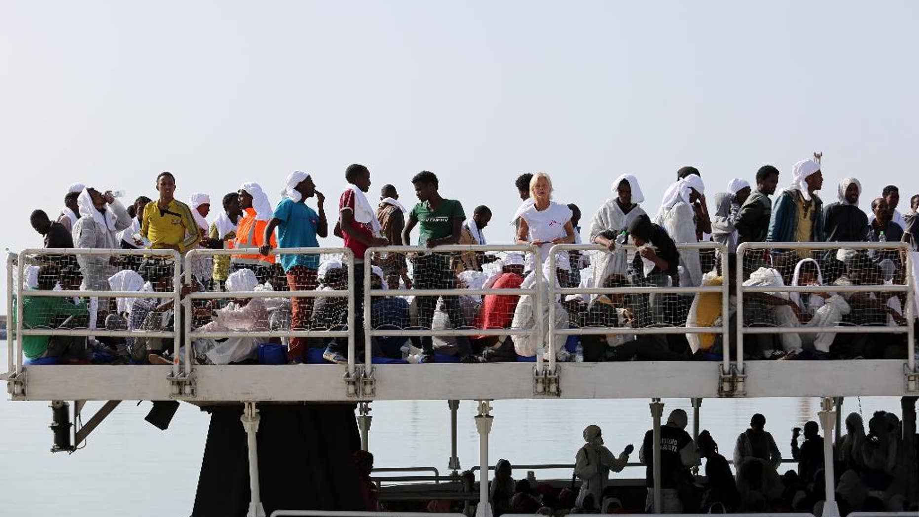 May 5, 2015: Migrants wait to disembark from the ' The Phoenix ' a Malta-based Migrant Offshore Aid Station, in the Sicilian harbor of Pozzallo, Italy. More than 350 migrants were on the Maltese-registered ship that brought them to safety, according to Doctors Without Borders who are helping with the rescue effort.